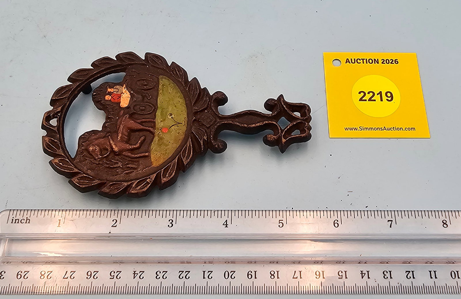 Cast iron trivet, painted, horse drawn carriage ride on front, 5 x 3 x 1/2" (1 of 2)