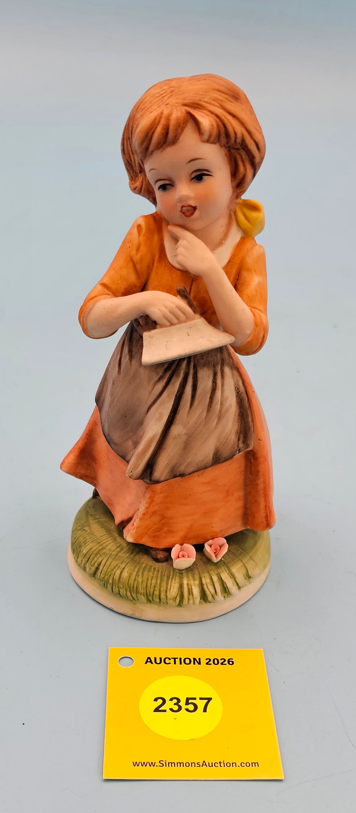 Porcelain figurine, girl holding iron, by Royal Crown Vtg 6 1/4" (1 of 1)