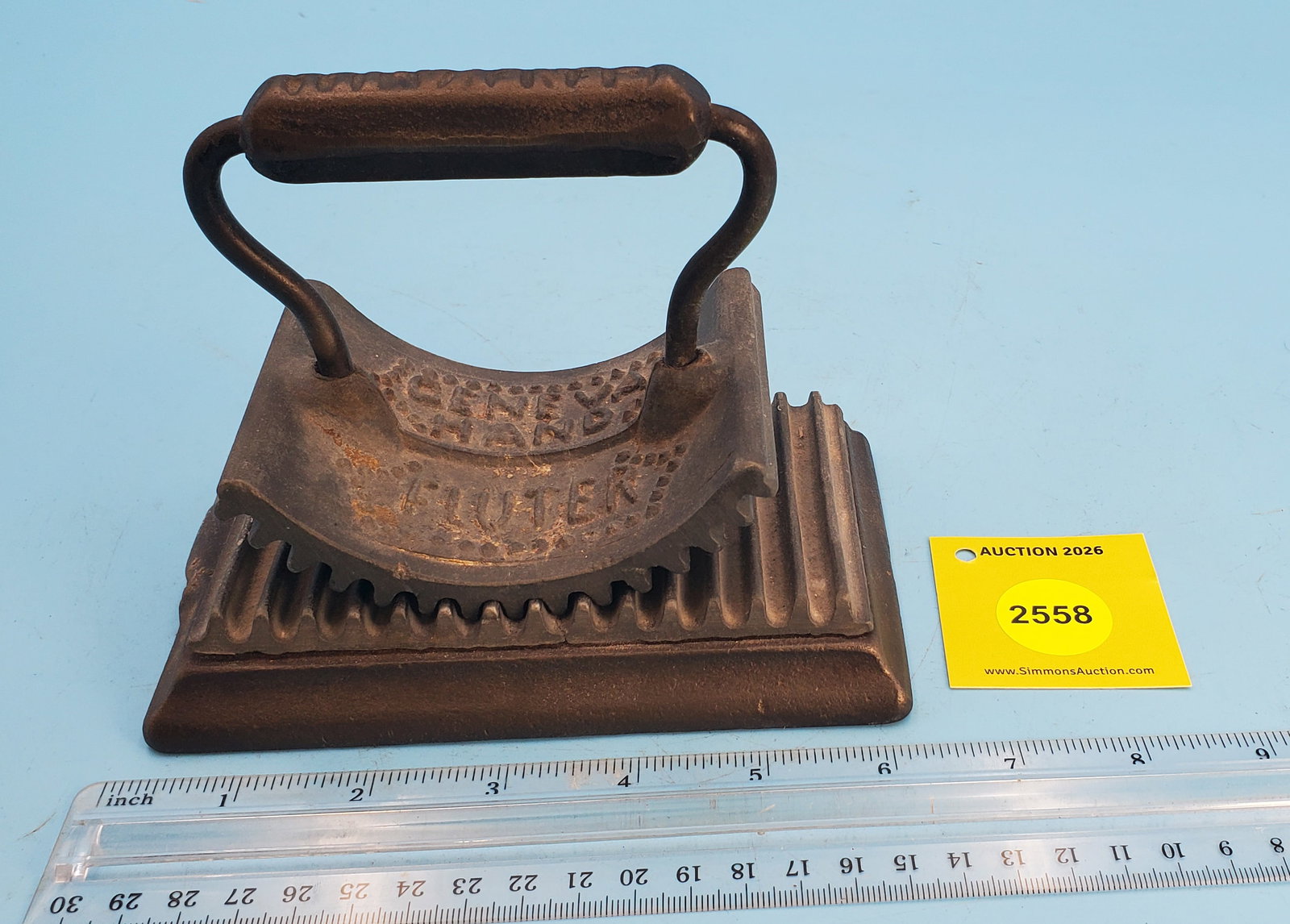 Rocker, Geneva Hand Flutter, Geneva Ill, Heat This, Pat'd 1866, lead like material for both parts...: Rocker, Geneva Hand Flutter, Geneva Ill, Heat This, Pat'd 1866, lead like material for both parts of fluter, L 5 3/4"