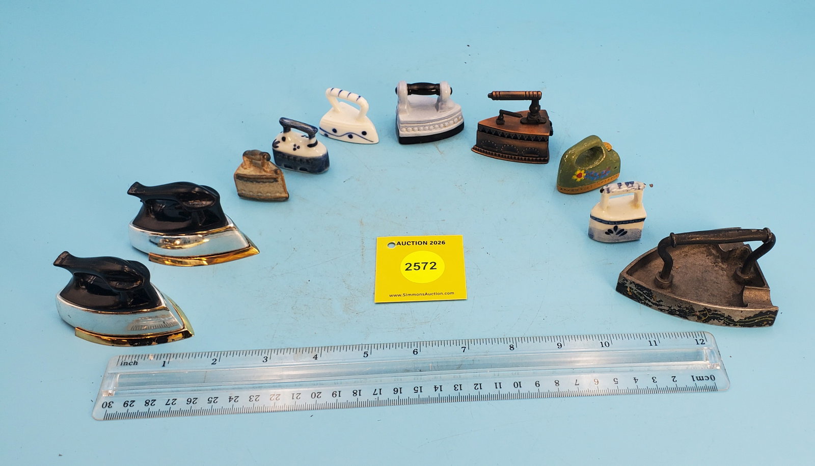 Lot of 9, ceramic, plastic and metal irons, one is a pencil sharpener and 1 set of salt and peppe... (1 of 1)