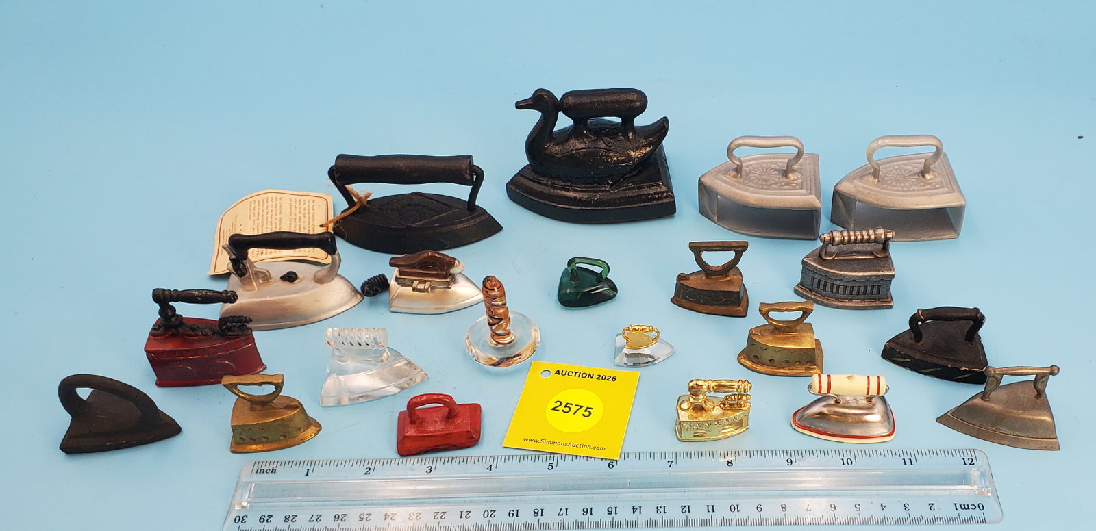 Lot of 21 various toy/miniature irons (1 of 1)