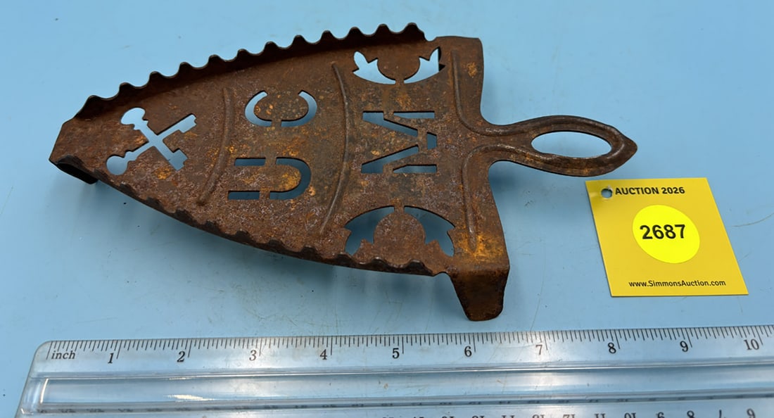 Pierced Metal UCM trivet w/ handle and three legs (1 of 2)