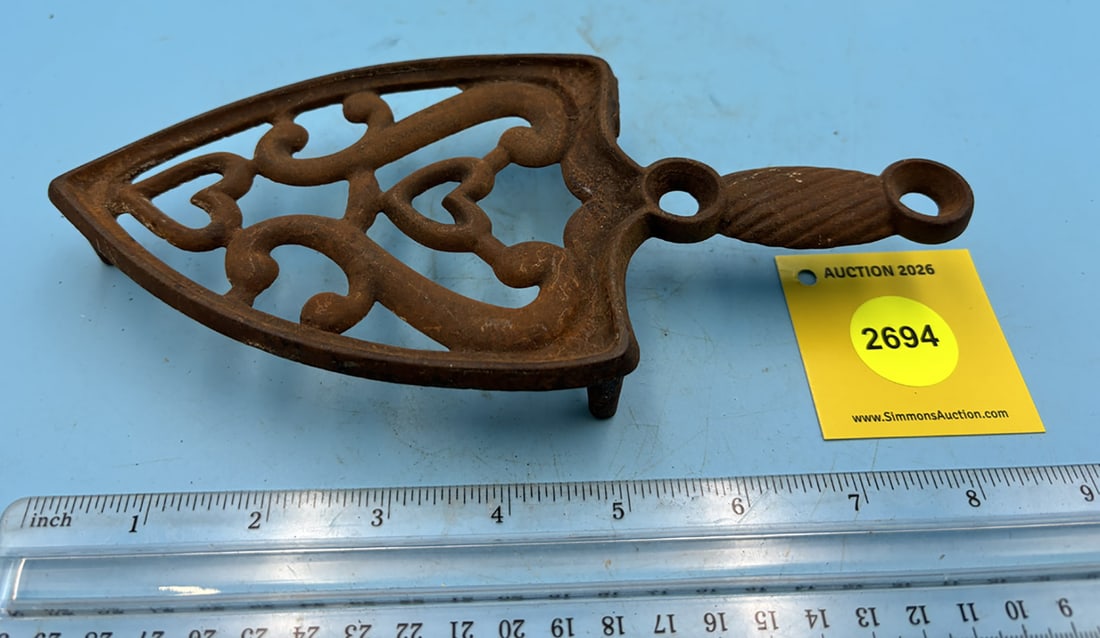 Heart and Urn trivet w/ handle and three legs (1 of 2)