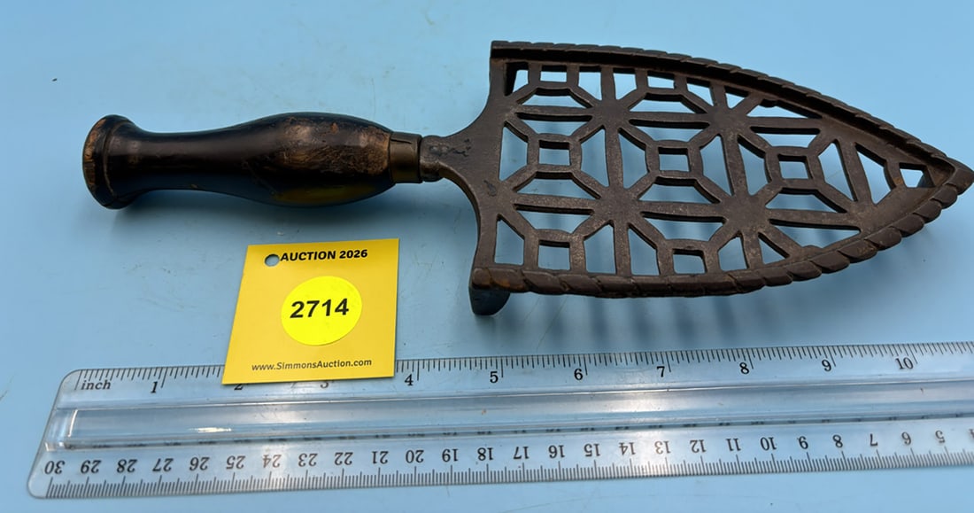 Triangler trivet w/ long wooden handle, geometric pattern, w/ three feet: Triangler trivet w/ long wooden handle, geometric pattern, w/ three feet