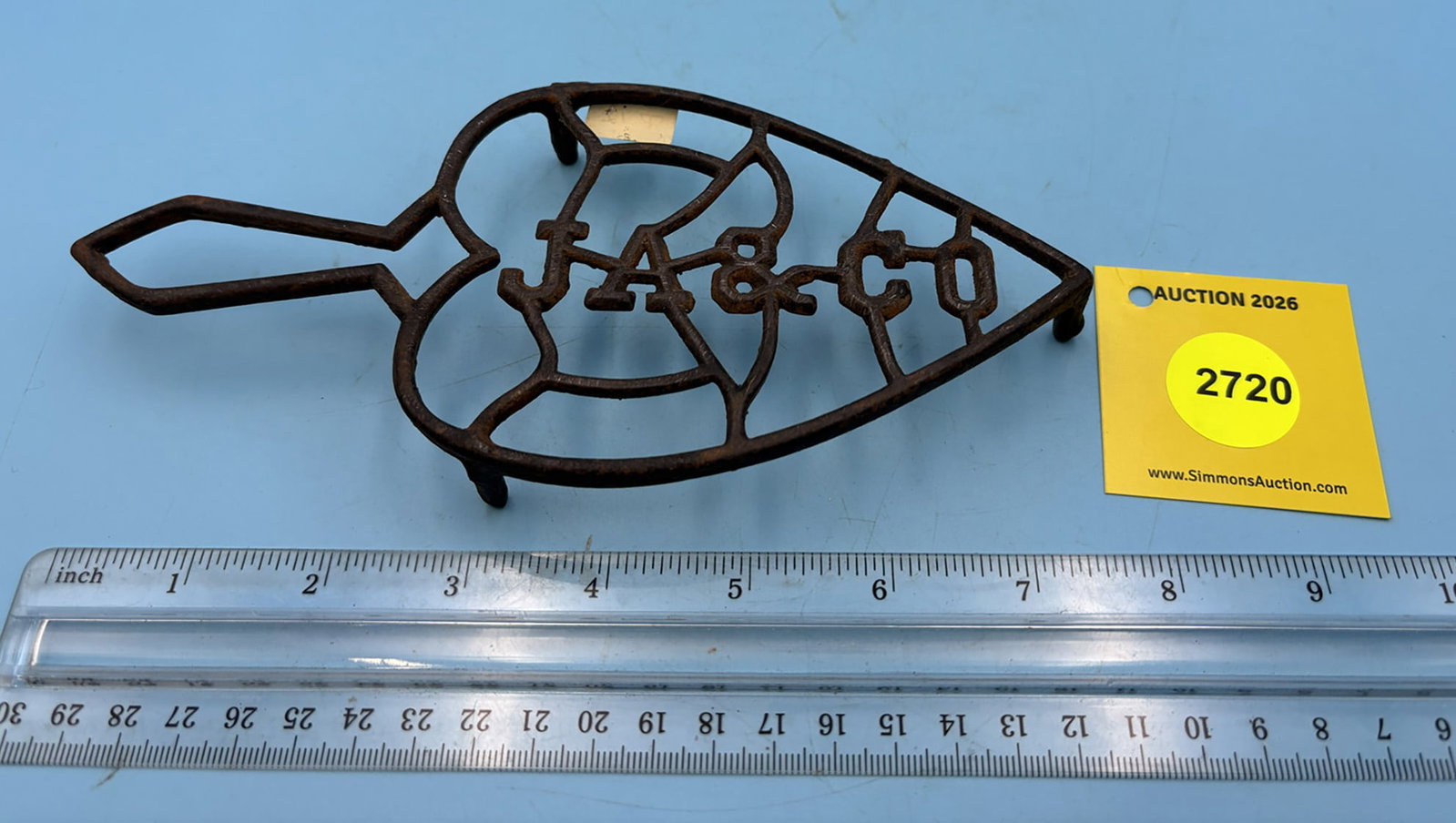 JA & Co. trivet w/ handle and three feet: JA & Co. trivet w/ handle and three feet