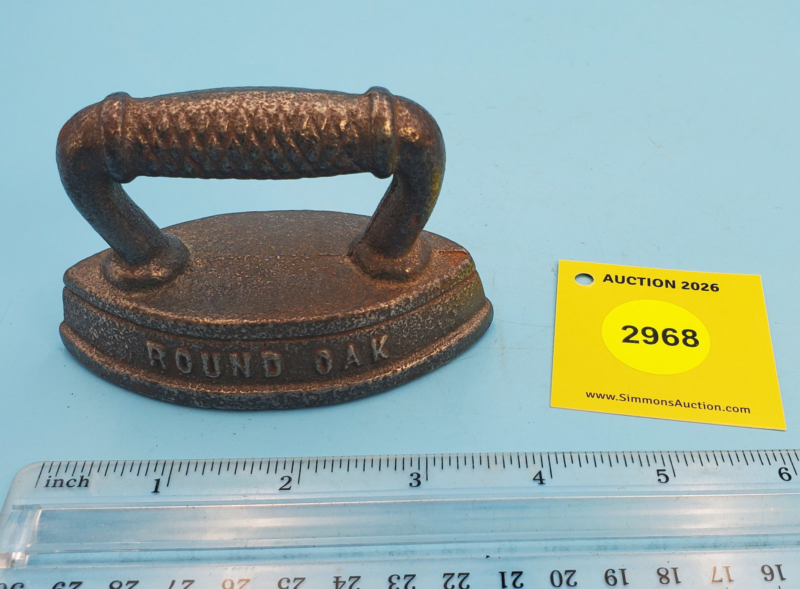 Child's iron, round oak advertising piece double point: Child's iron, round oak advertising piece double point