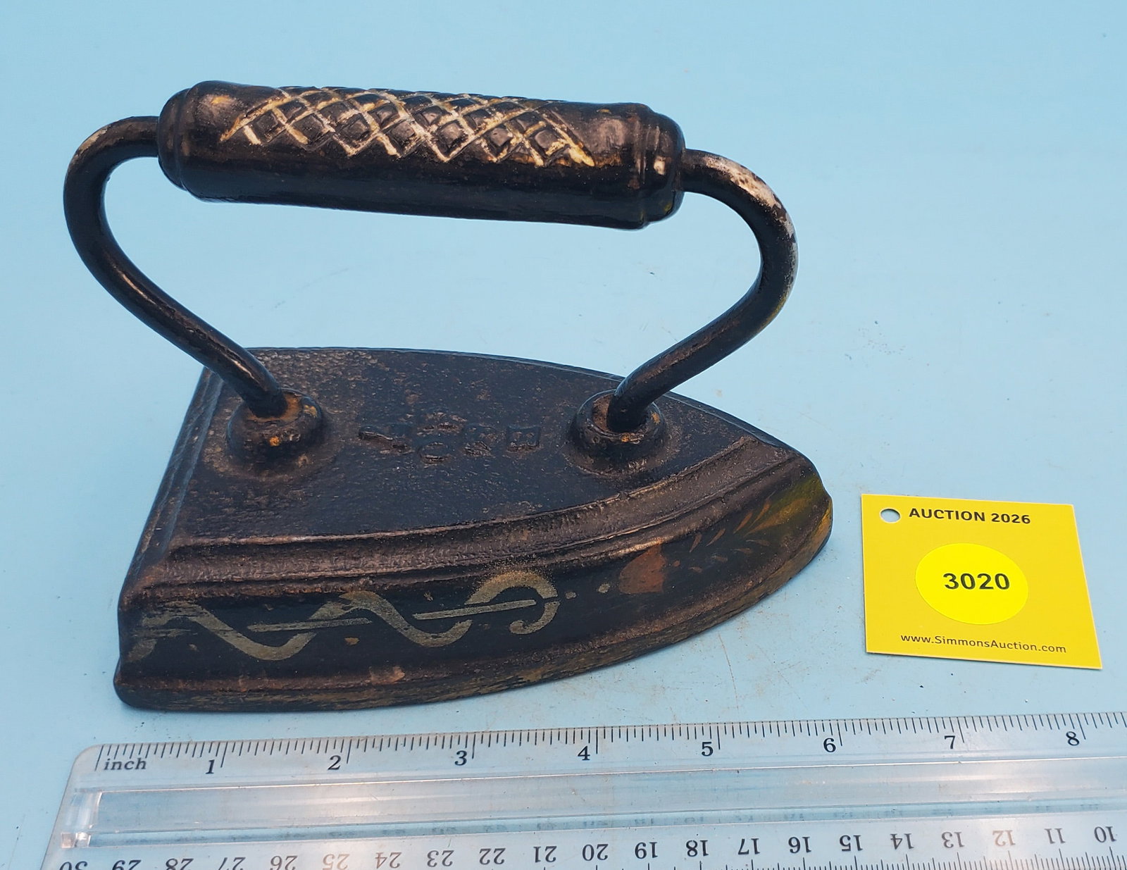 Flat iron w/stencilled design of man and animals, B & Co. "7" (1 of 3)