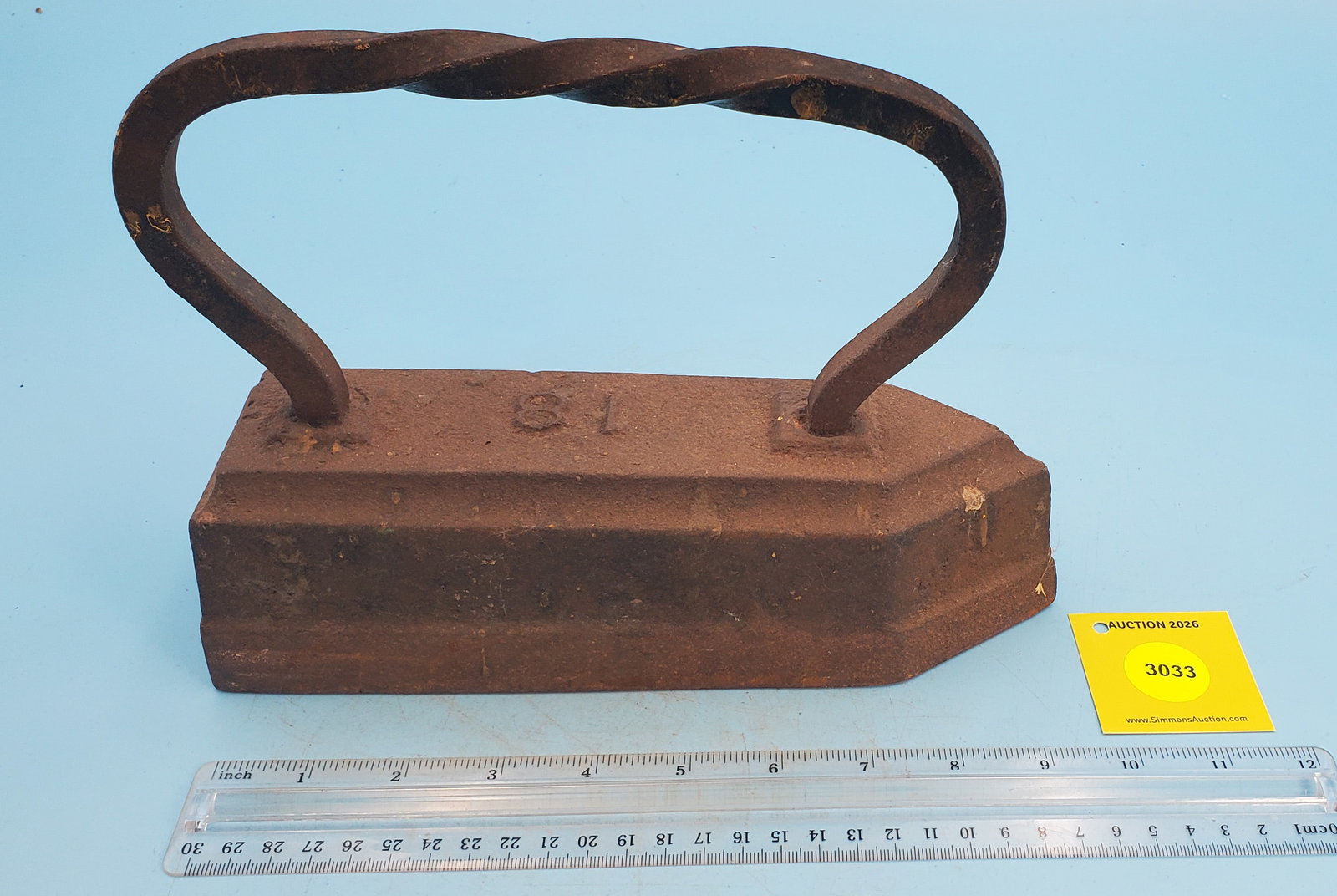 Unmarked tailor's iron w/twisted rectangular rod handle (1 of 2)