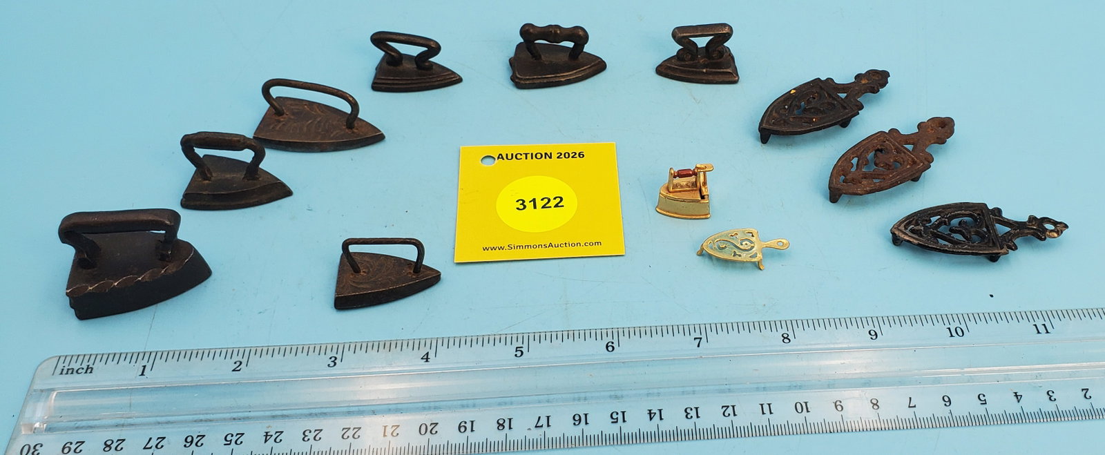 Large lot of miniature irons and trivets: Large lot of miniature irons and trivets