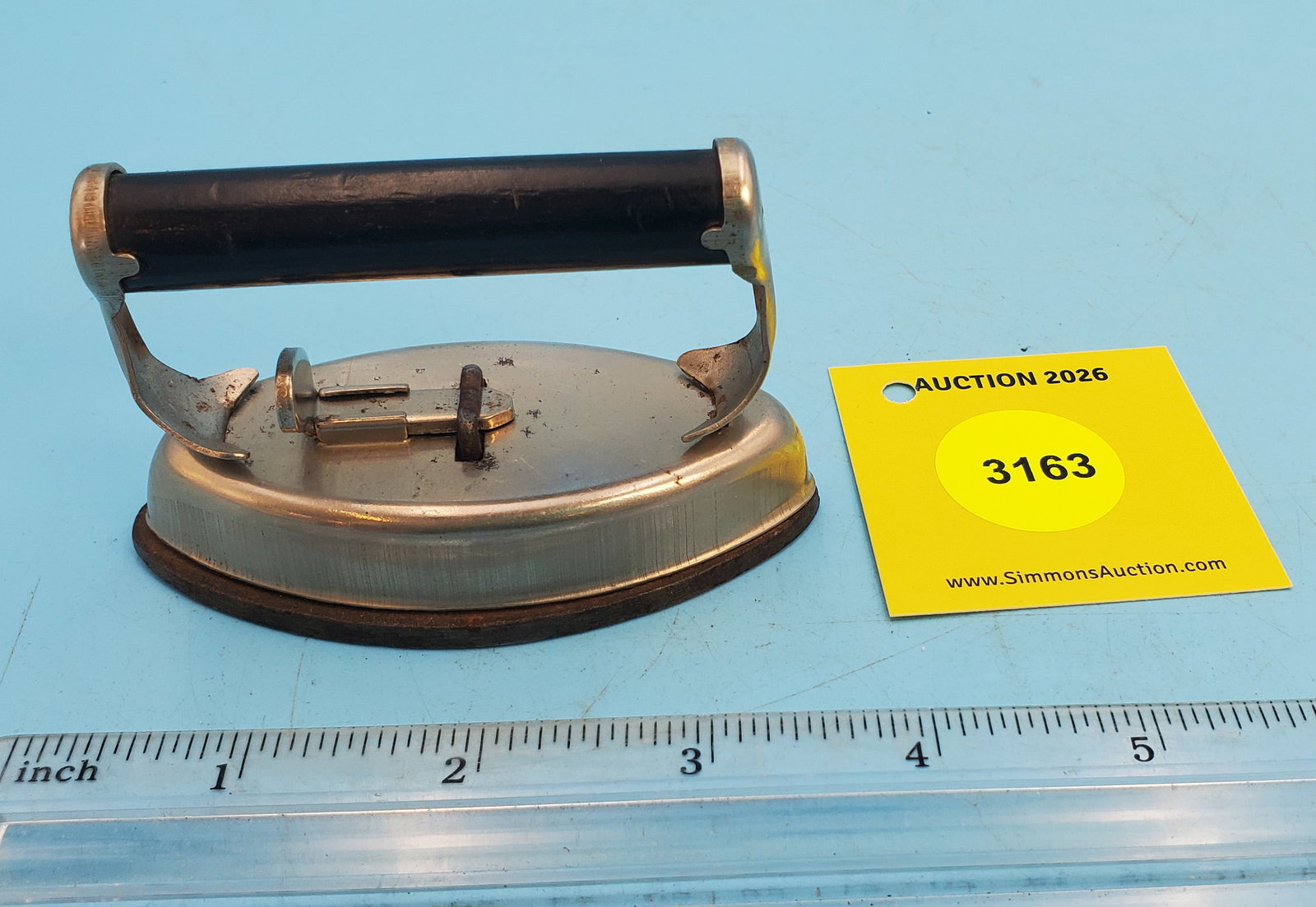 Two piece child's iron, black handle, no markings, L 3 3/8": Two piece child's iron, black handle, no markings, L 3 3/8"
