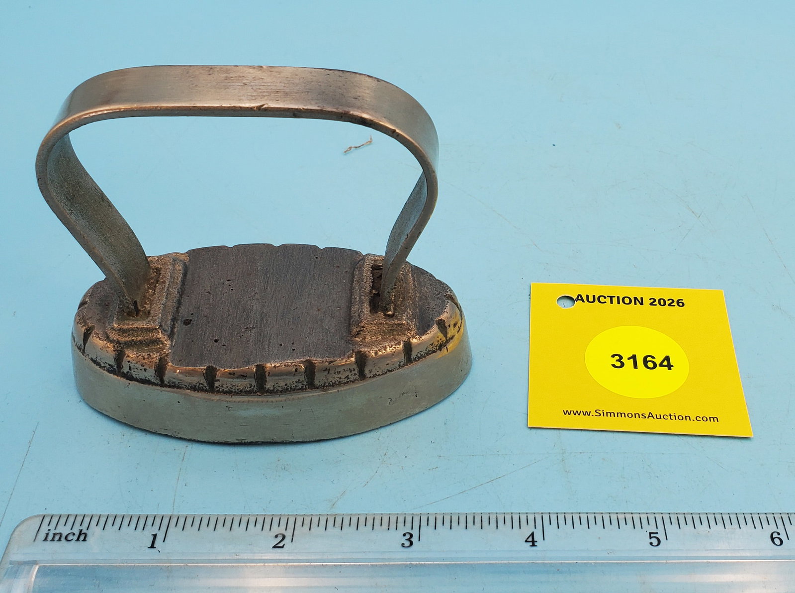 Oval iron, no markings, strap handle, L 3 5/8": Oval iron, no markings, strap handle, L 3 5/8"
