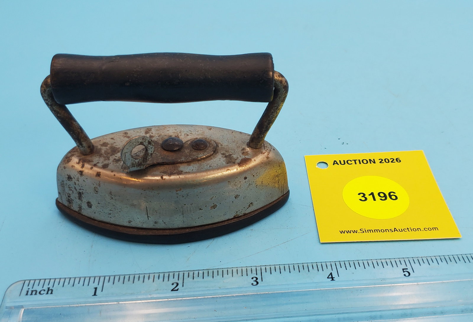 Two piece child's iron, black handle, no markings, L 3 3/8": Two piece child's iron, black handle, no markings, L 3 3/8"