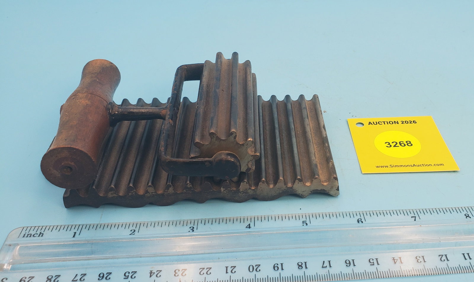 Roller, unmarked, base plate has decorative bottom edge (1 of 3)