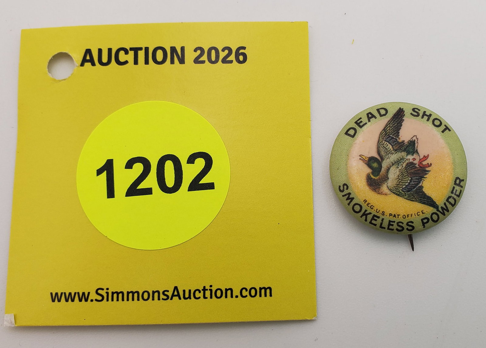 Dead shot smokeless powder pin, J.B. Carroll (1 of 2)