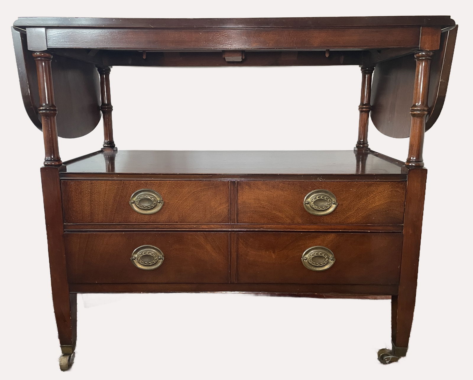 Mid-Century Drexel Mahogany Rolling Drop leaf Server: Drexel "New Travis Court Collection" Mahogany Drop-Leaf Serving Cart, mid-20th-century furniture item fabricated in Feb, 1949. Crafted in a Federal or Duncan Phyfe style, these servers are known for t