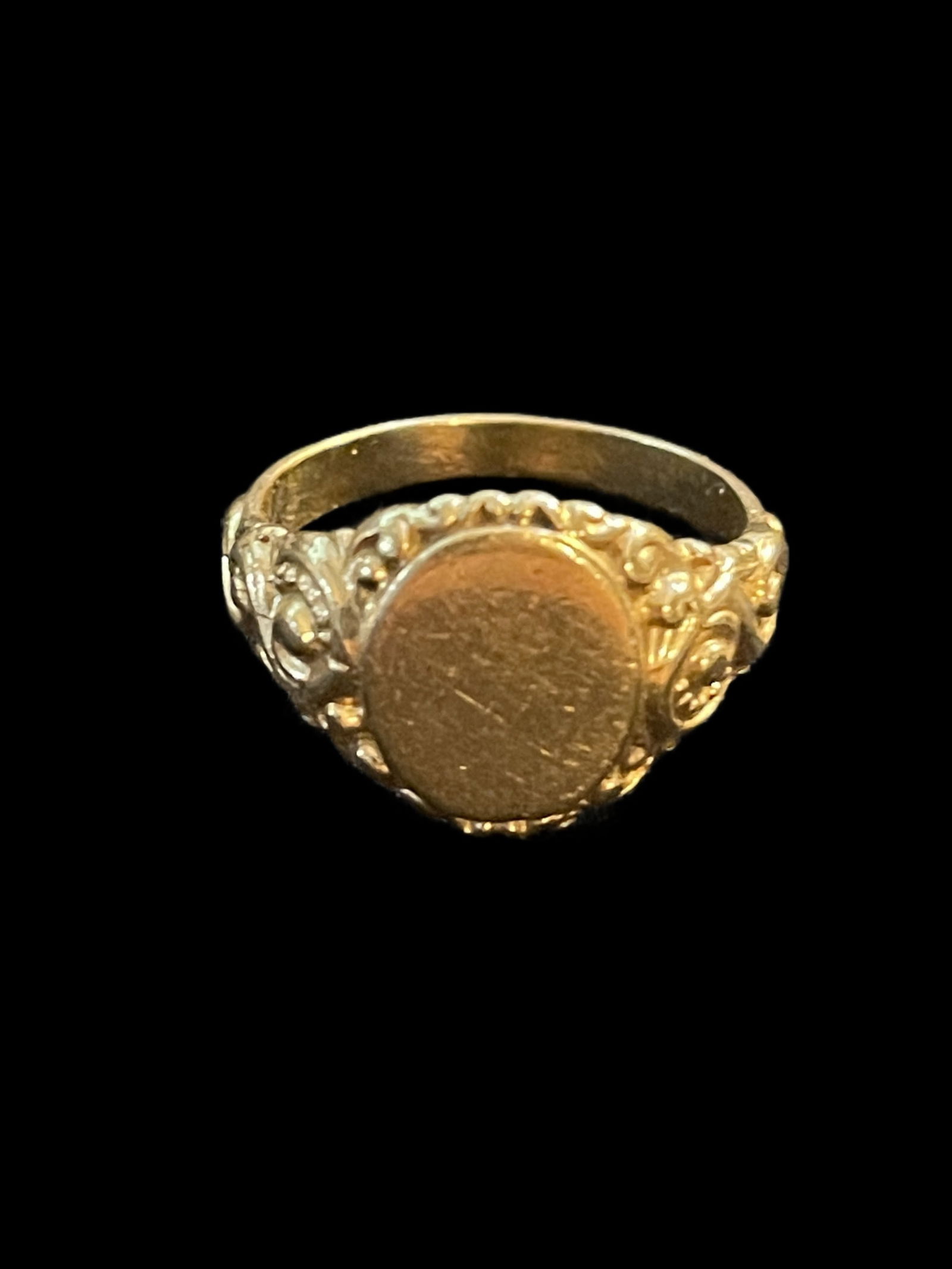 14K Gold Signet Ring featuring an oval top and floral shoulders: 14K Gold Signet Ring featuring an oval top and floral shoulders