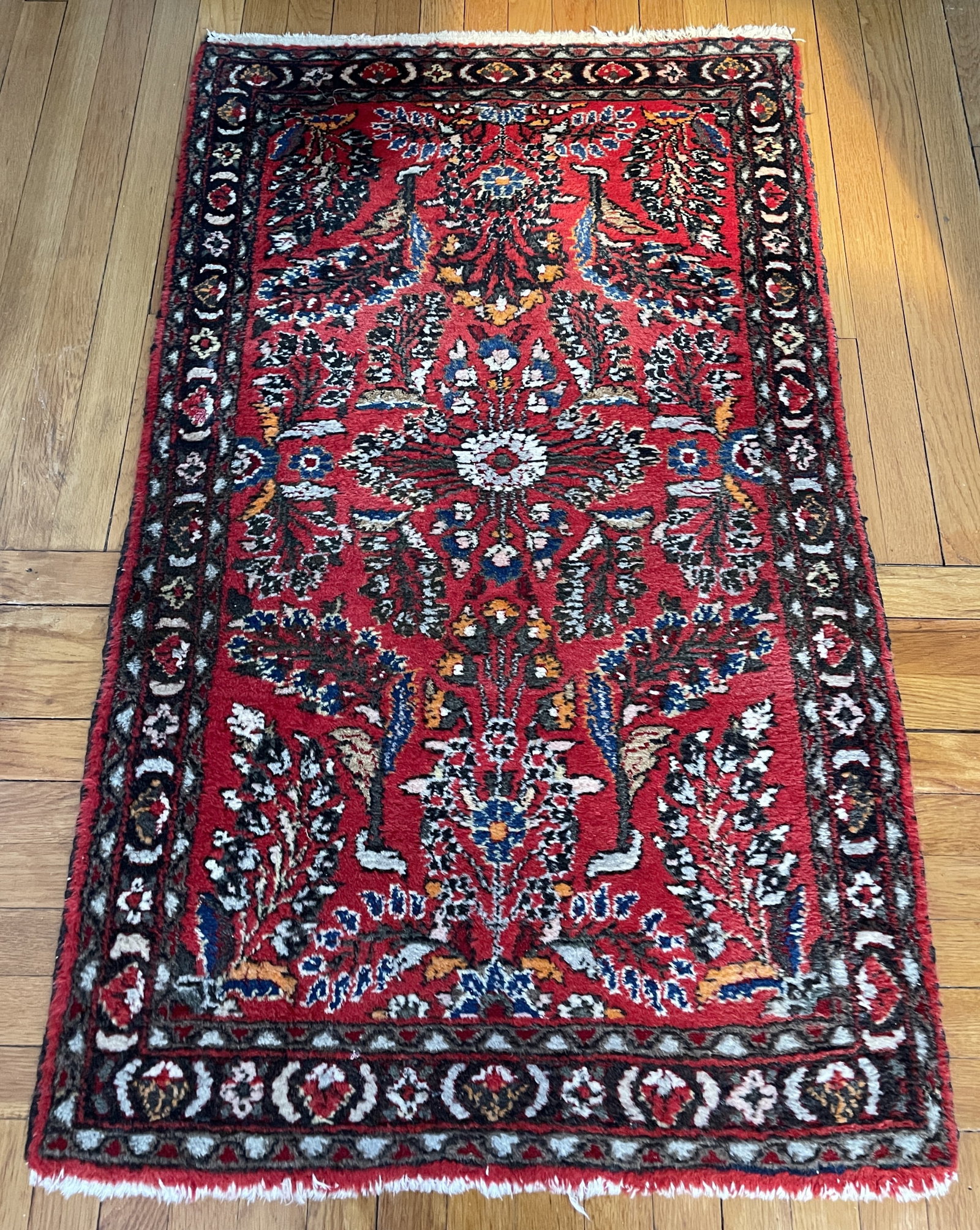 Vintage, hand-knotted Persian Sarouk or Lilian runner rug: Vintage, hand-knotted Persian Sarouk or Lilian rug featuring a vibrant red field with intricate floral and medallion motifs.