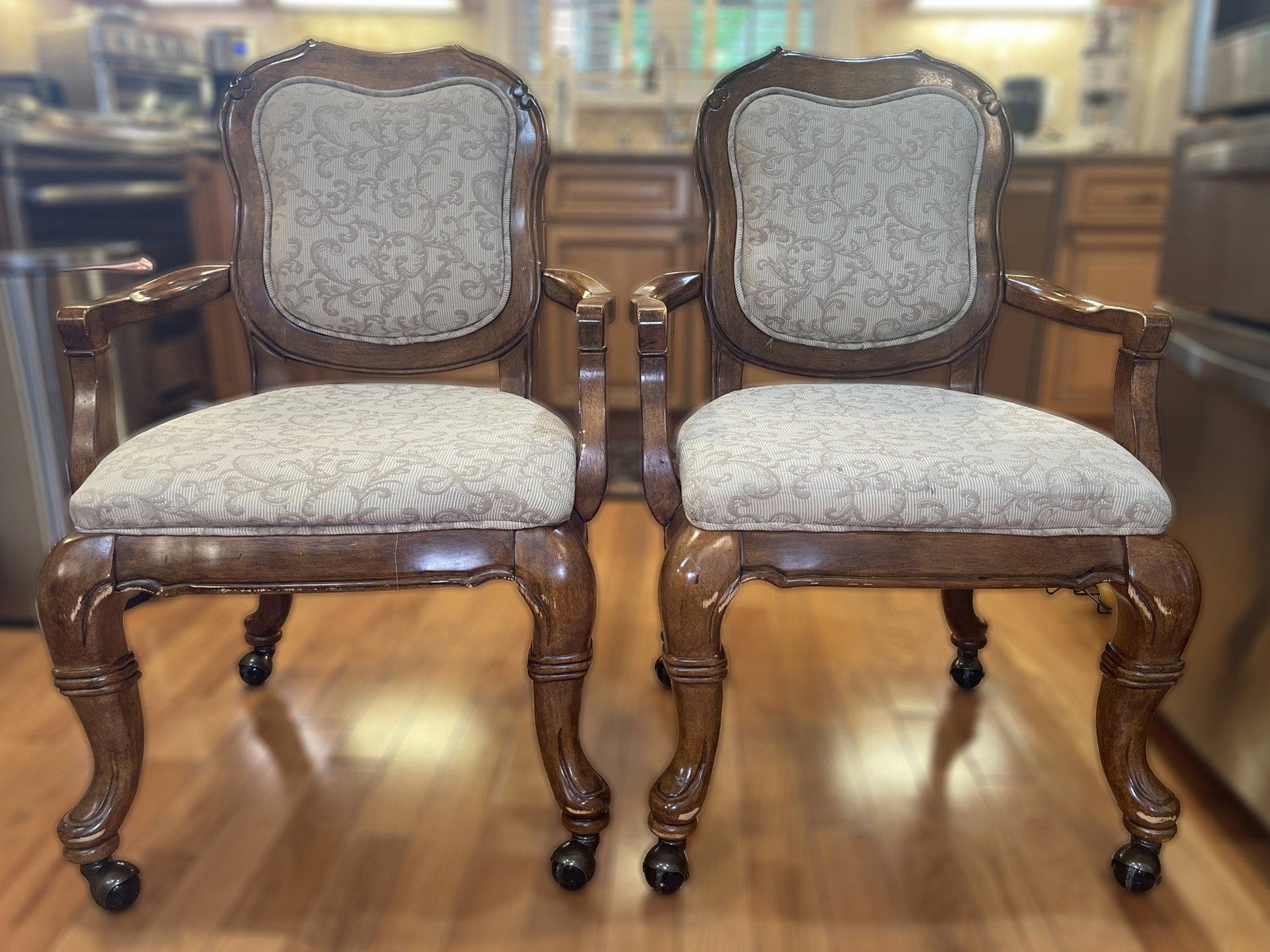 Bassett Mirror Company Vintage Victorian-Style Rolling Upholstered Arm Chairs - Set of 2Item: Beautiful set of two traditional accent armchairs brings old-world charm to any space. They feature heavy, hand-carved wood frames with a rich antique oak finish. The elegant curved legs and backrest 