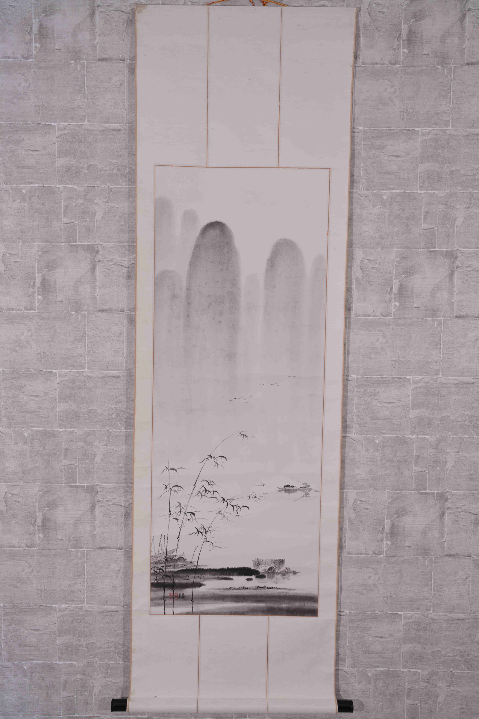 A LANDSCAPE-AND-BAMBOO PAINTING ON PAPER: Landscape-and-bamboo painting on paper