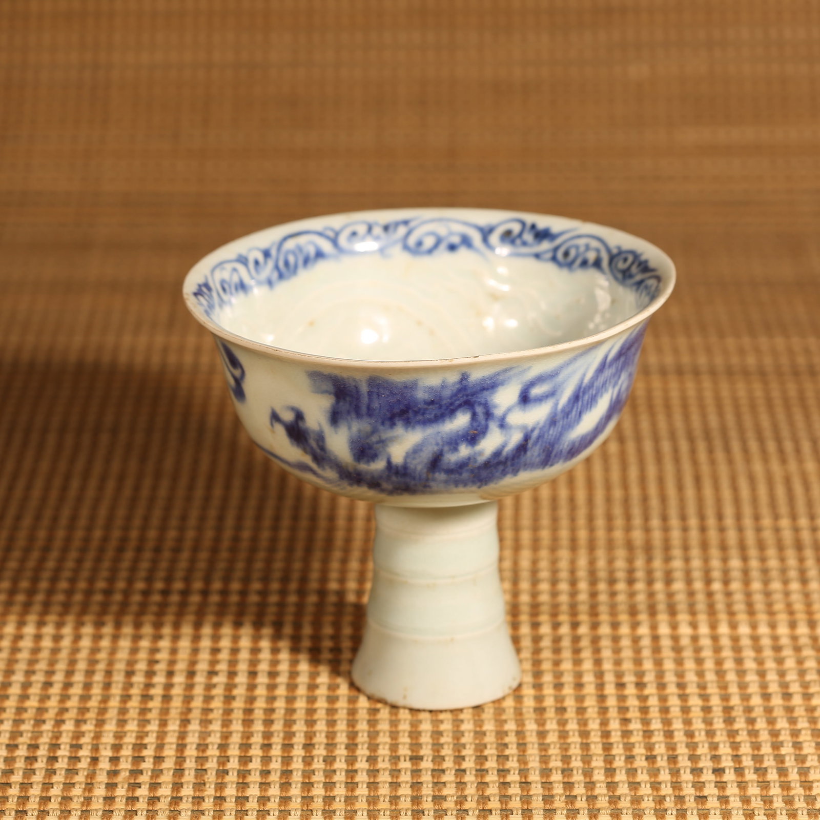A YUAN DYNASTY BLUE-AND-WHITE DRAGON MOTIF TALL STEM CUP (1 of 8)