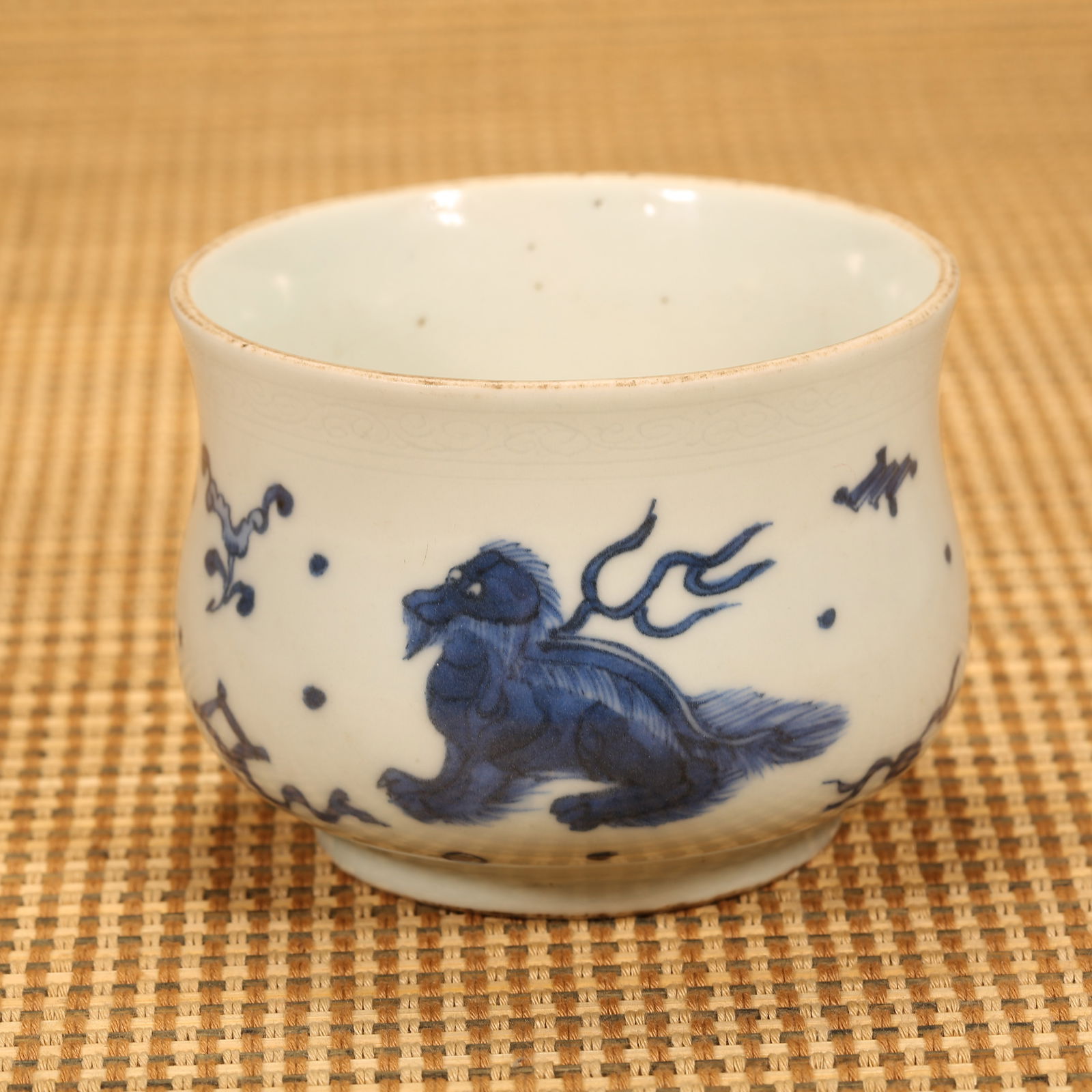 A MING DYNASTY CHONGZHEN BLUE-AND-WHITE CENSER WITH AUSPICIOUS BEAST MOTIF (1 of 8)