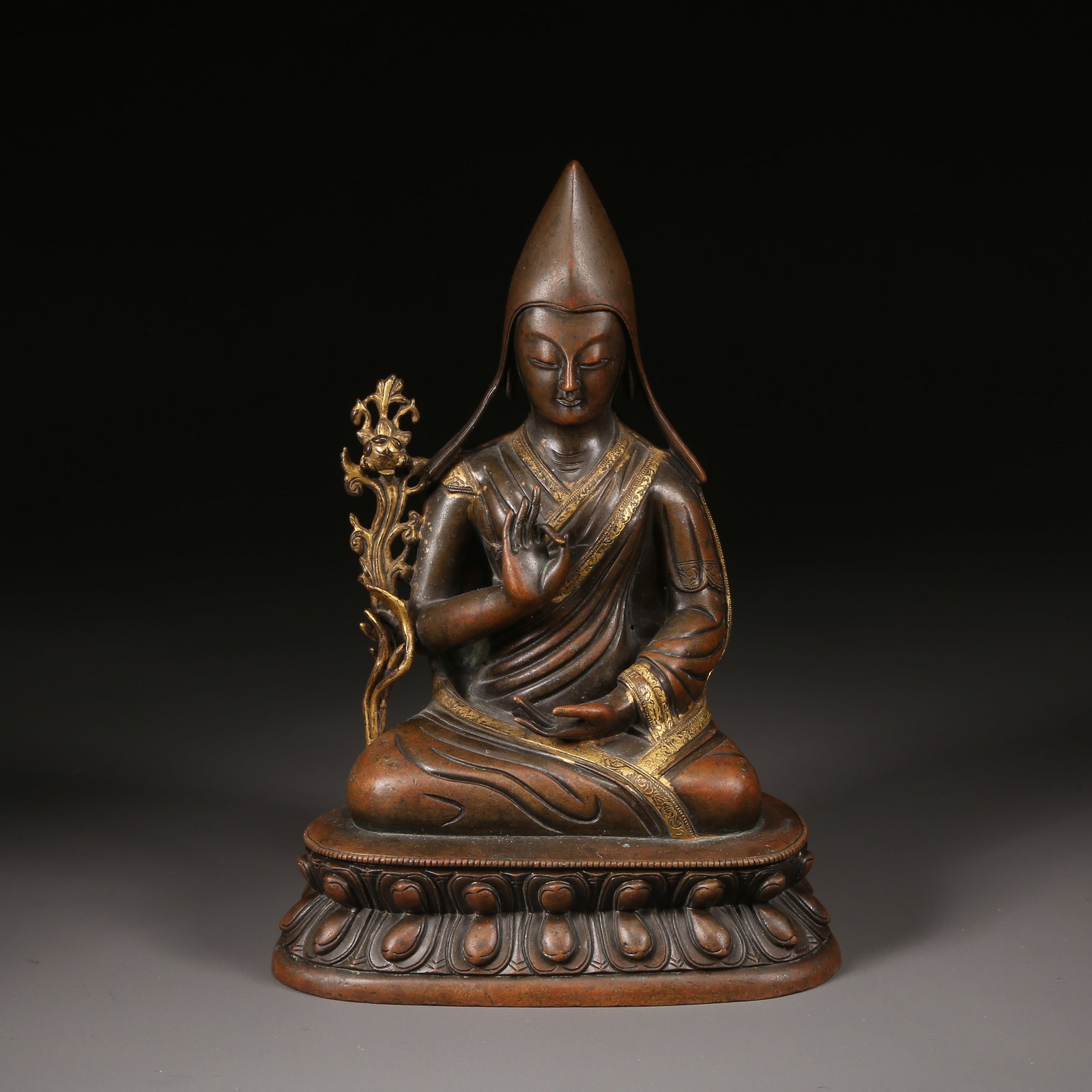 A QING DYNASTY PARTIALLY GILT-BRONZE LAMA STATUE (1 of 9)