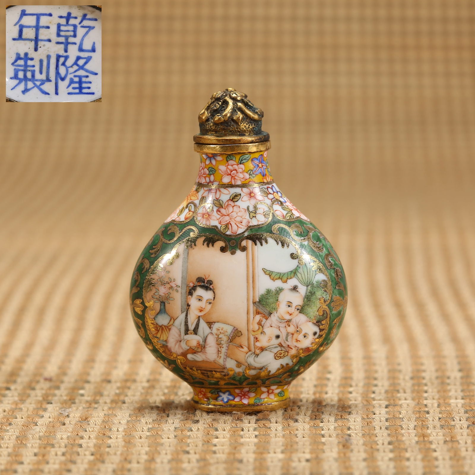 A QING DYNASTY QIANLONG PERIOD BRONZE-BODIED ENAMEL-PAINTED "TEACHING CHILDREN" SNUFF BOTTLE (1 of 8)