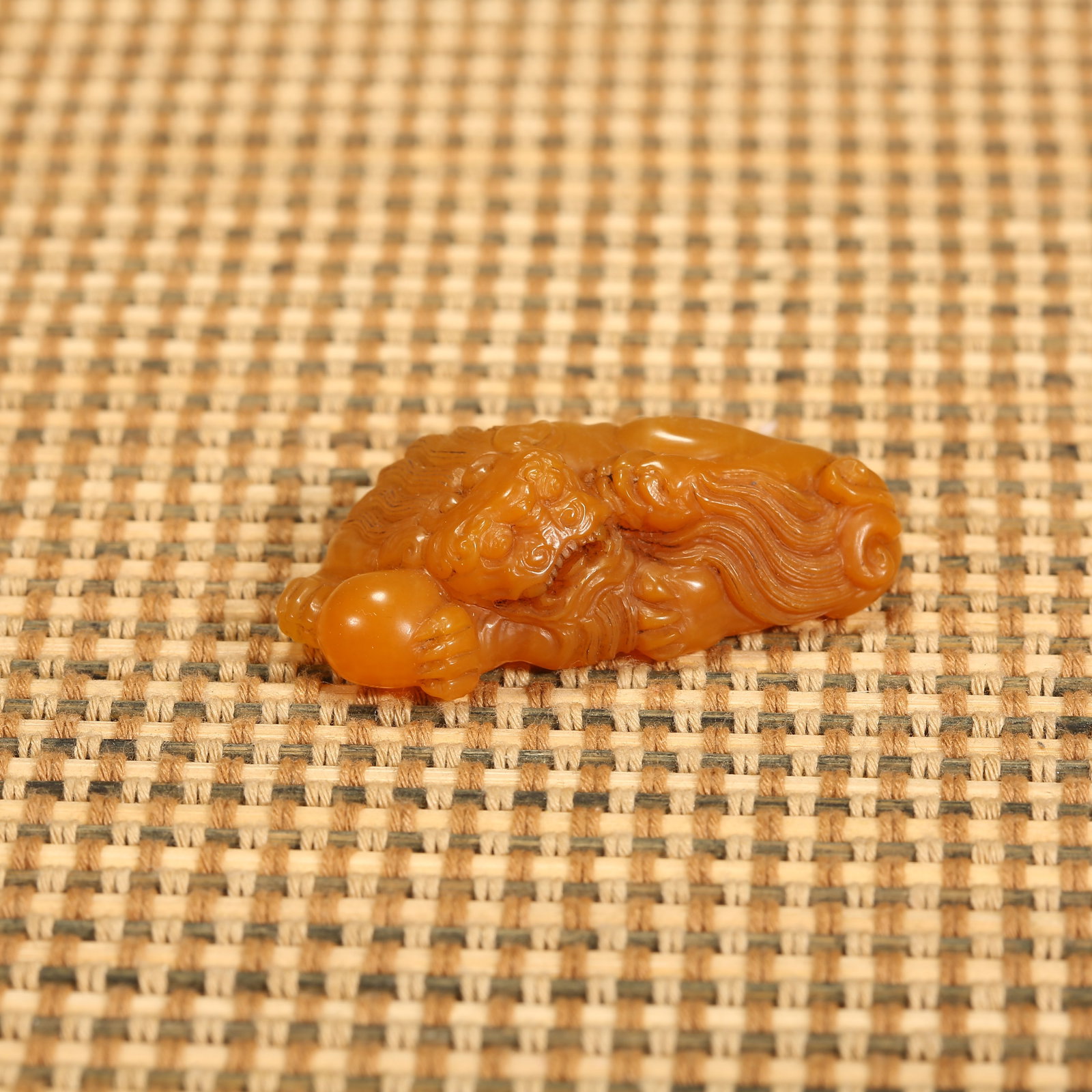 A QING DYNASTY SHOUSHAN TIANHUANG STONE ORNAMENT OF LION PLAYING WITH EMBROIDERED BALL: Qing Dynasty Shoushan Tianhuang Stone Ornament of Lion Playing with Embroidered Ball