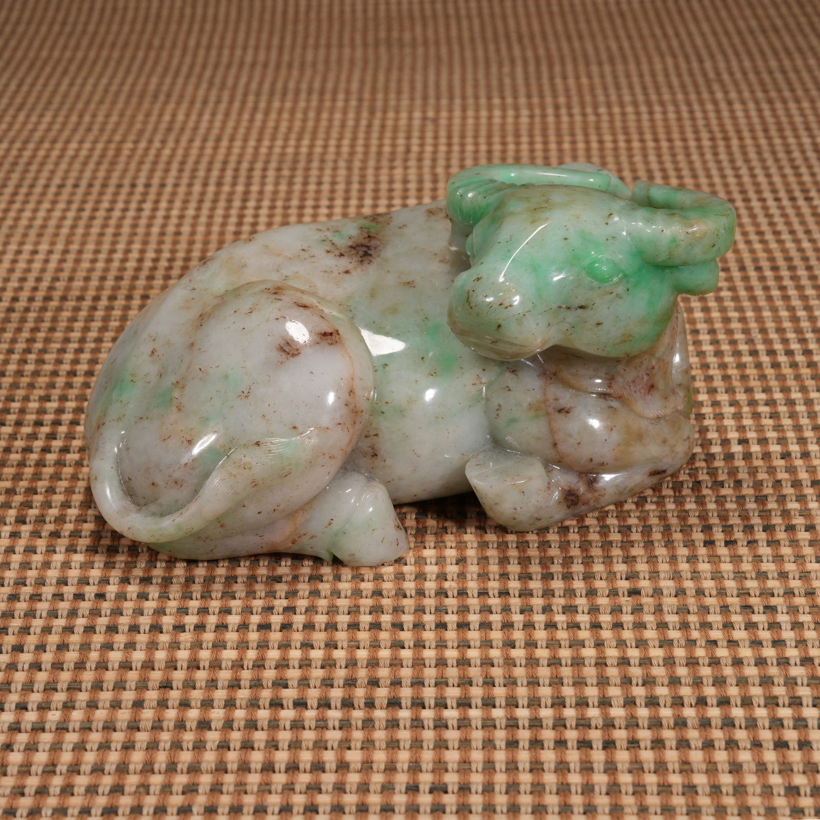 A QING DYNASTY, JADEITE RECLINING OX ORNAMENT (1 of 8)