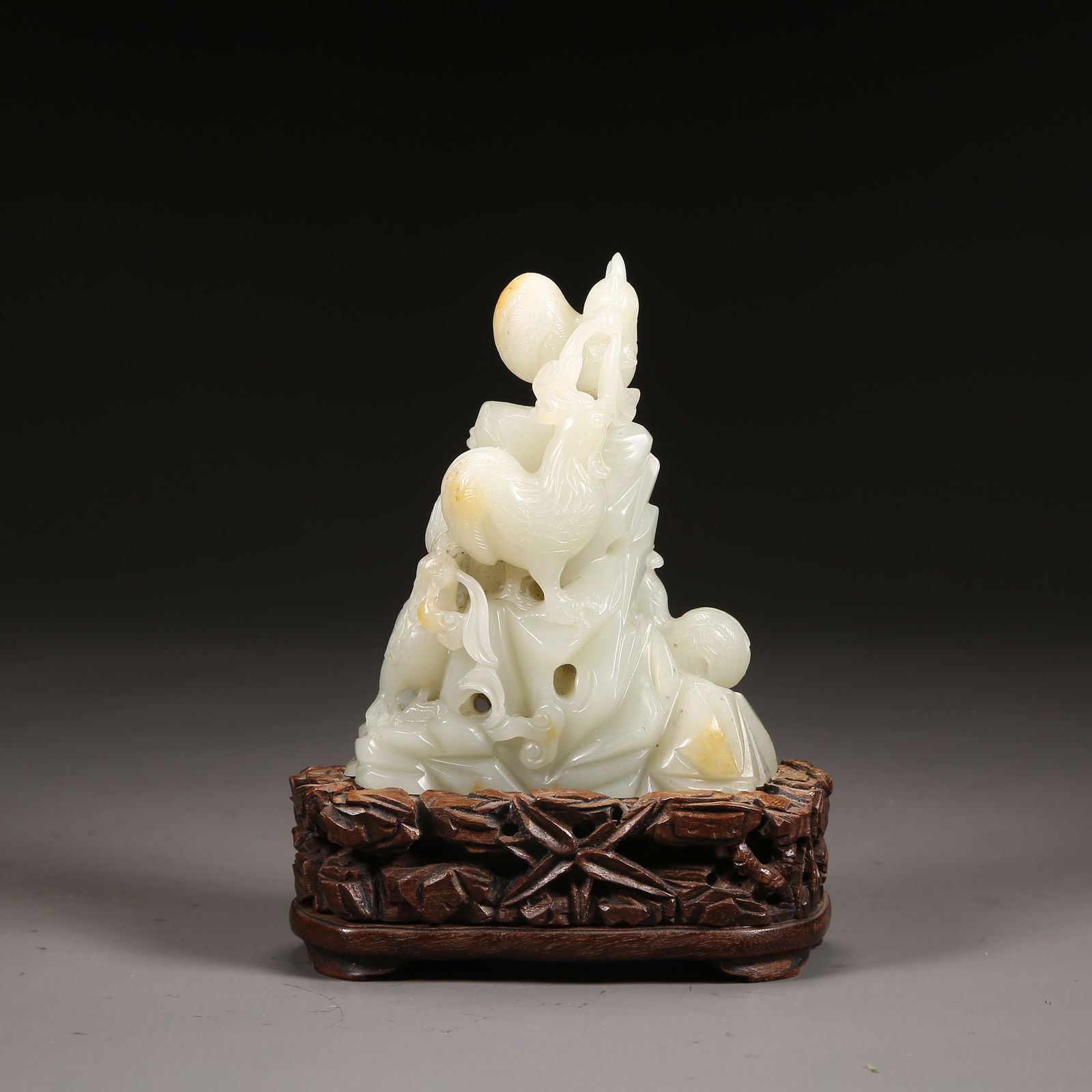 A QING DYNASTY HETIAN JADE "AUSPICIOUS" ORNAMENT (1 of 8)