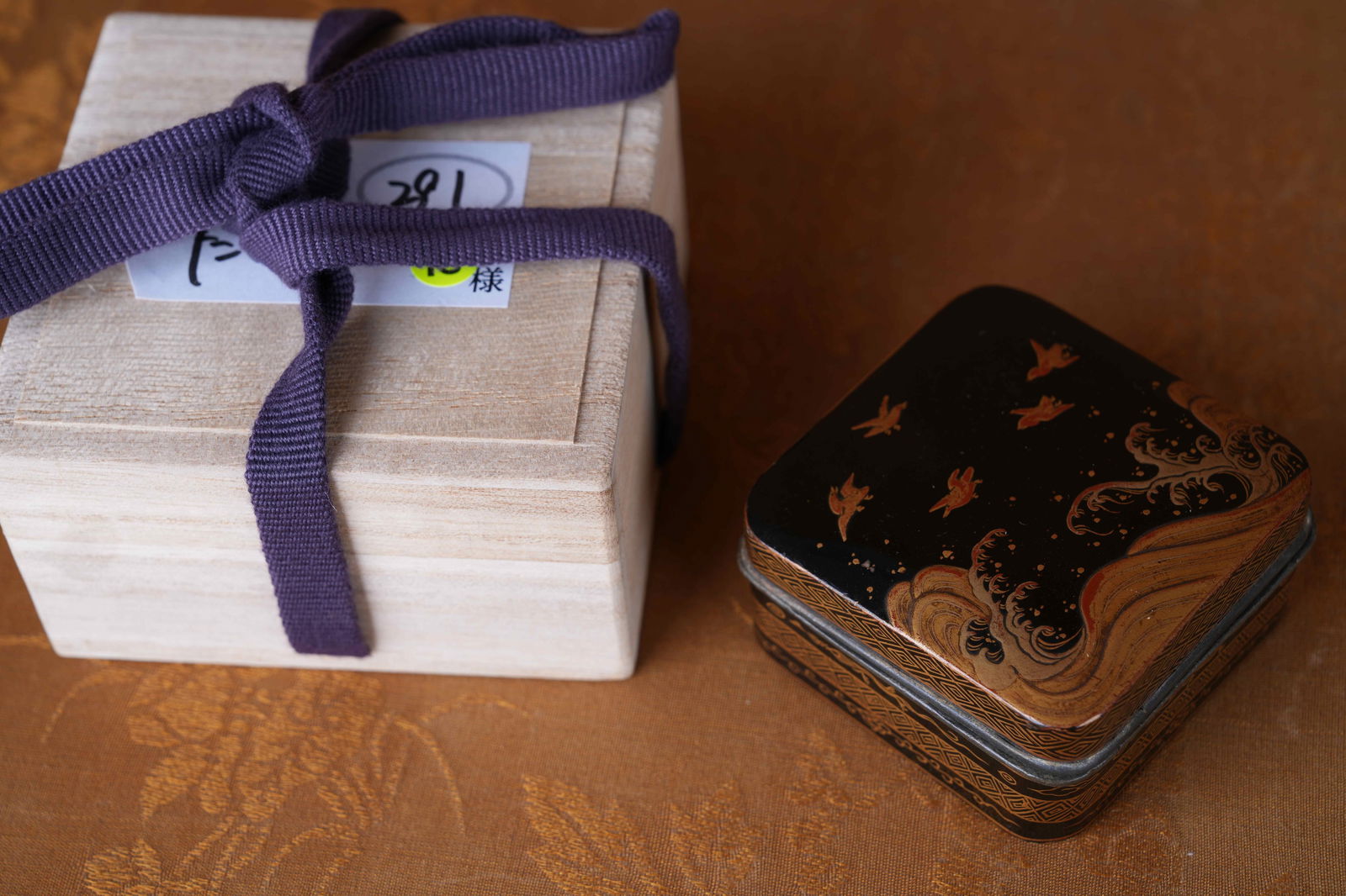 A BLACK-LACQUERED INCENSE BOX WITH GILT SEASCAPE DESIGN (1 of 6)