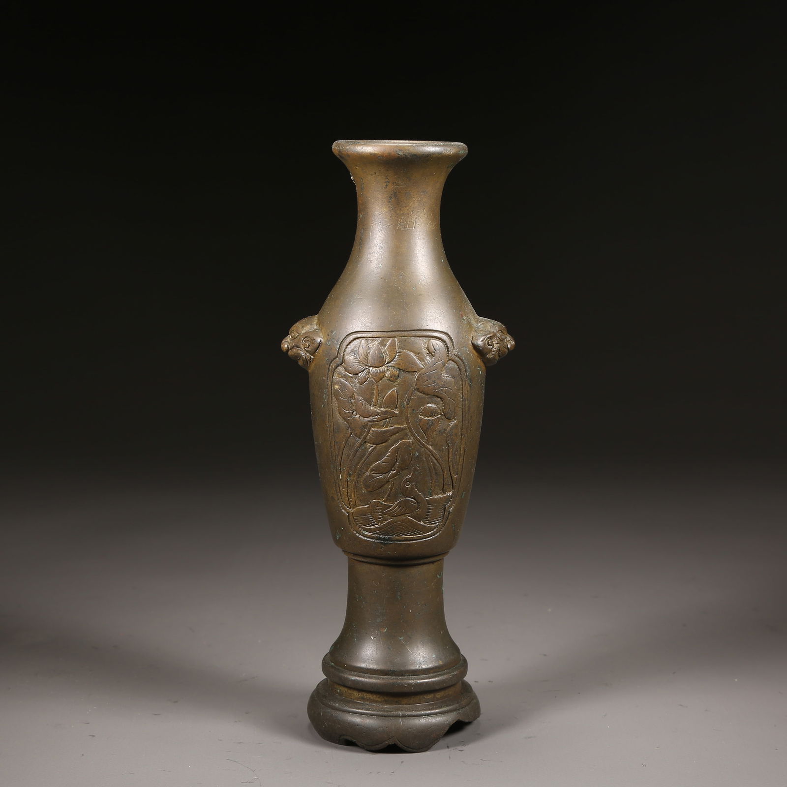 A QING DYNASTY BRONZE BEAST-EAR INCENSE BOTTLE (1 of 9)