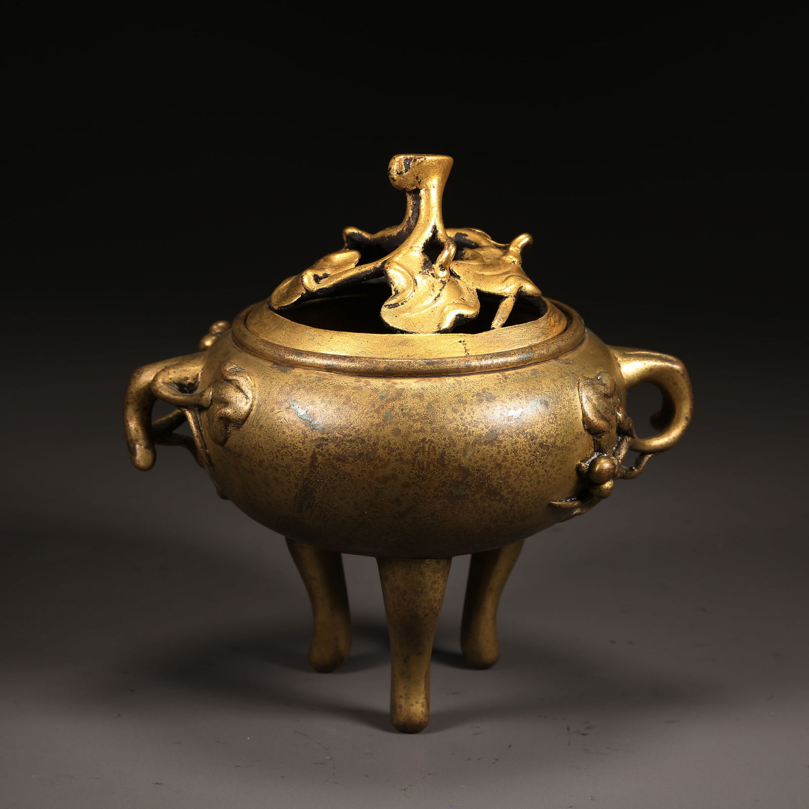 A QING DYNASTY GILT-BRONZE THREE-LEGGED CENSER WITH FLORAL-LEAF DECORATION (1 of 10)