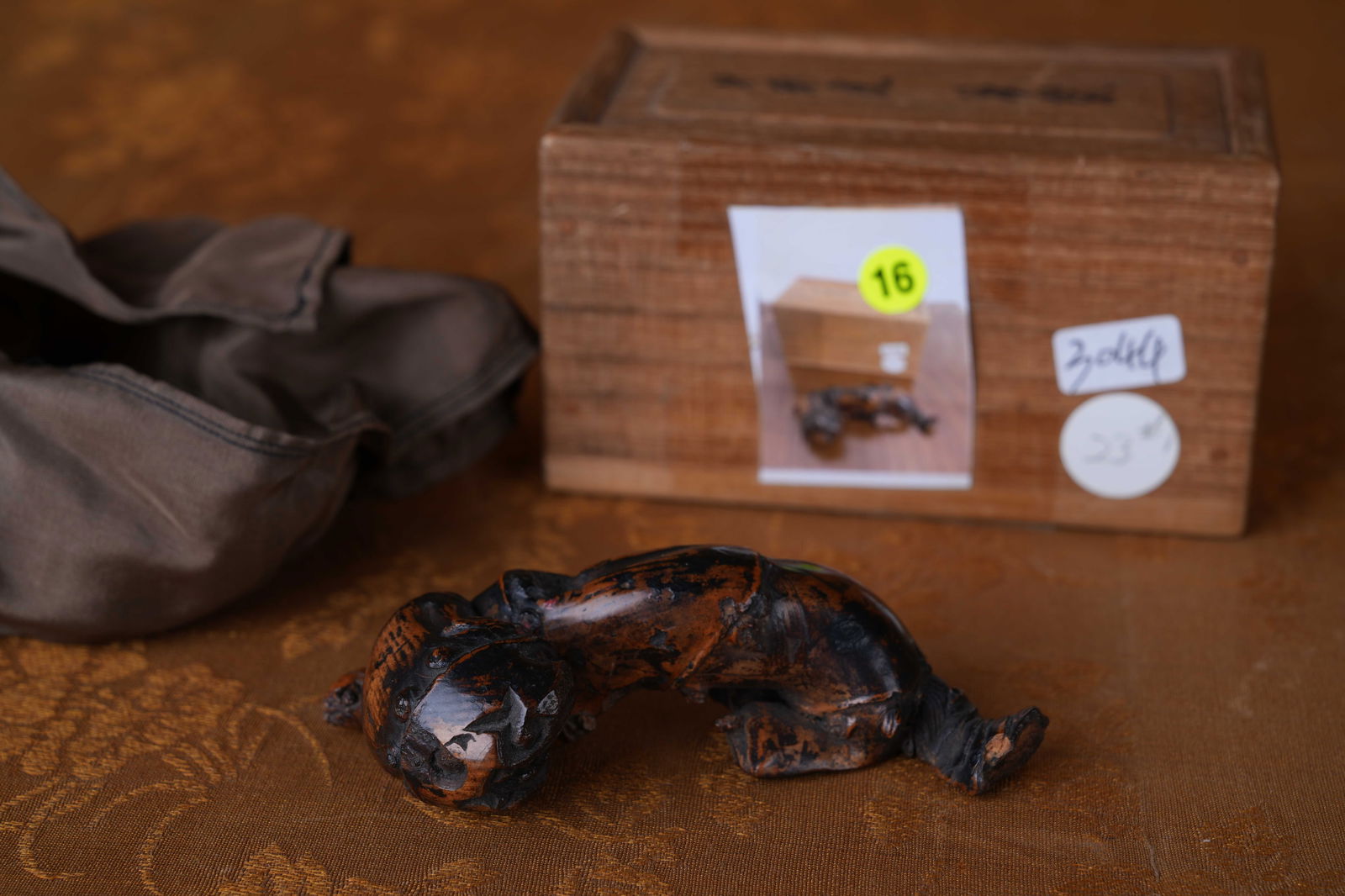 A BAMBOO-CARVED TIGER ORNAMENT: Bamboo-carved tiger ornament