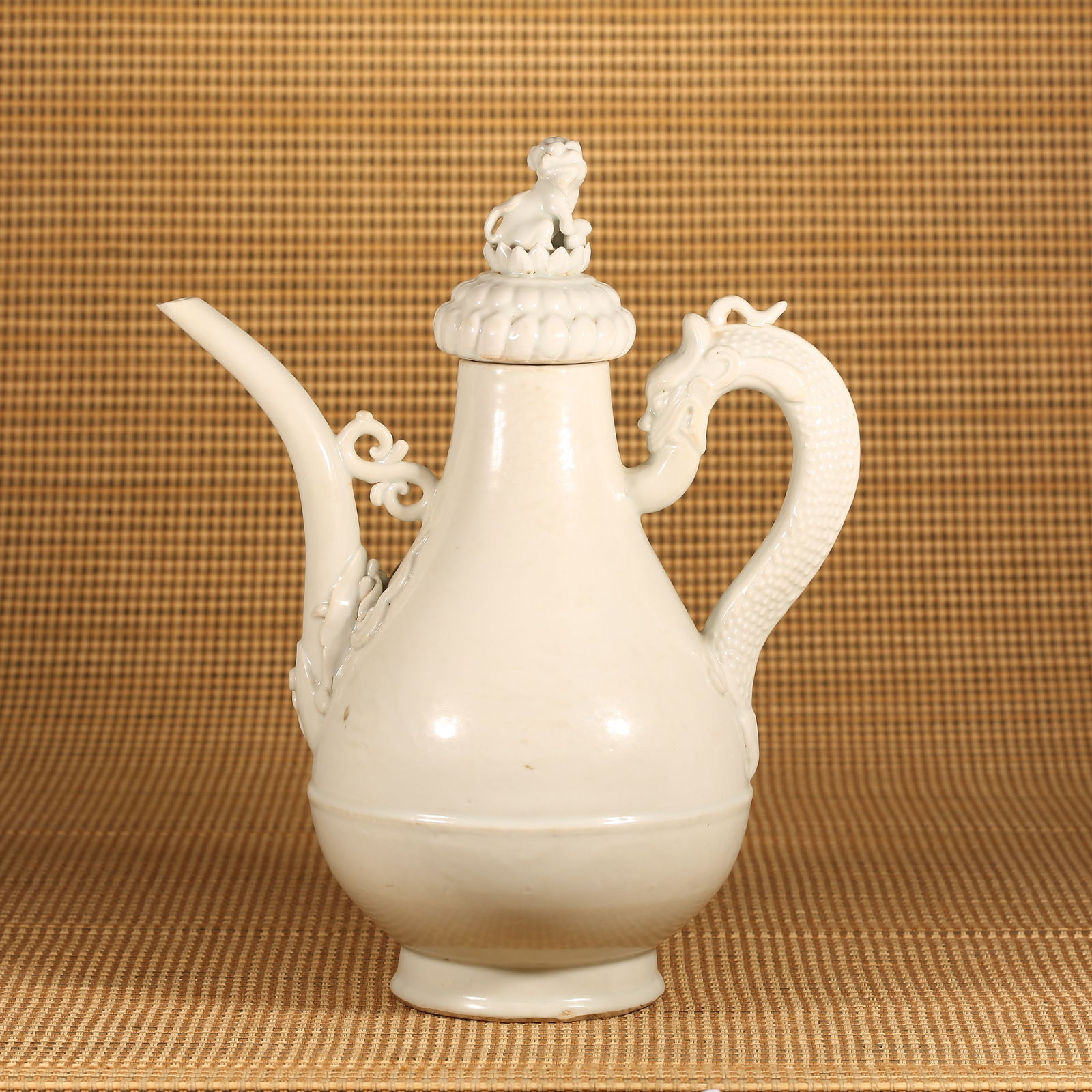 A YUAN DYNASTY SHUFU-GLAZED EWER WITH DRAGON HANDLE AND LION FINIAL (1 of 9)