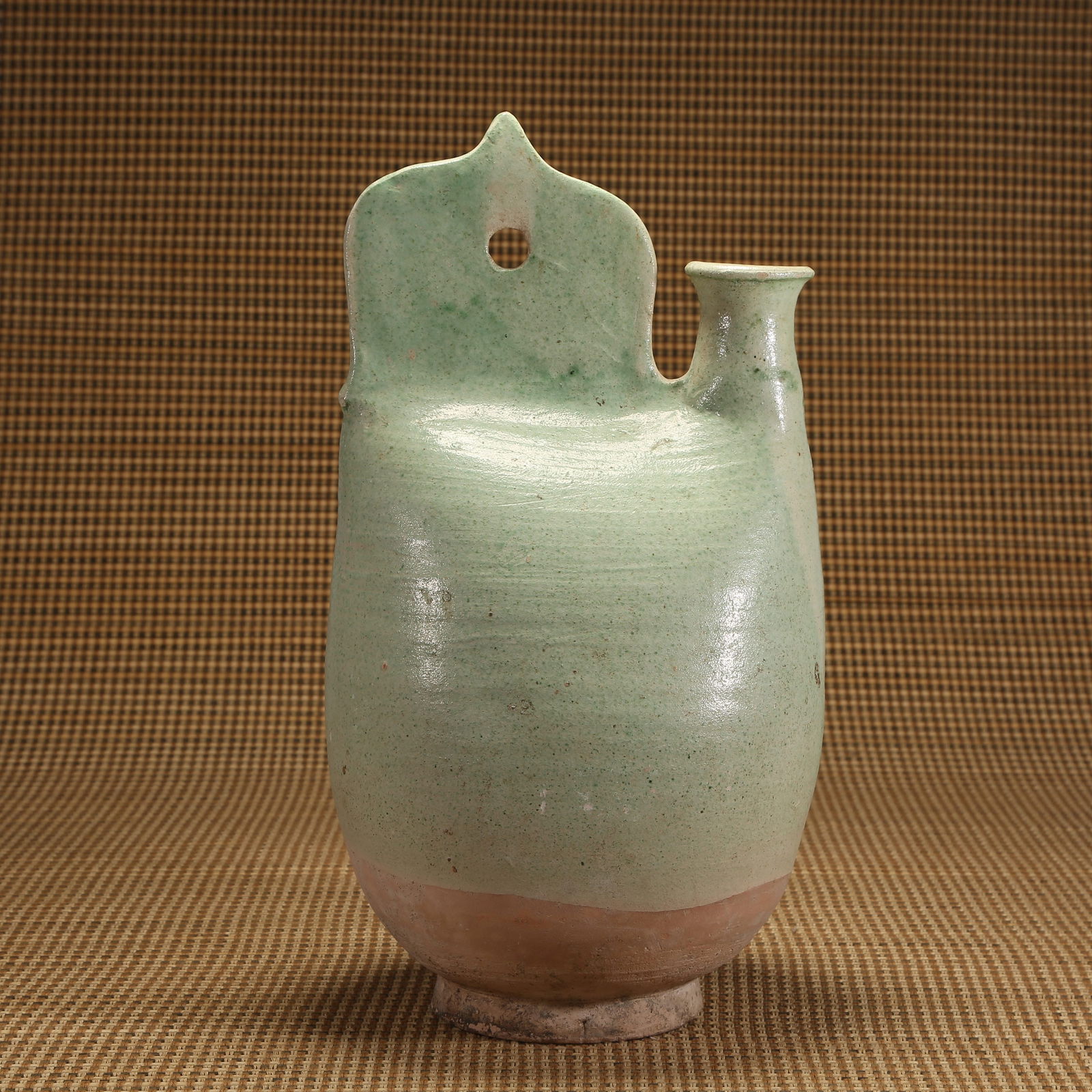 A LIAO DYNASTY GREEN-GLAZED BELLOW-SHAPED EWER (1 of 9)