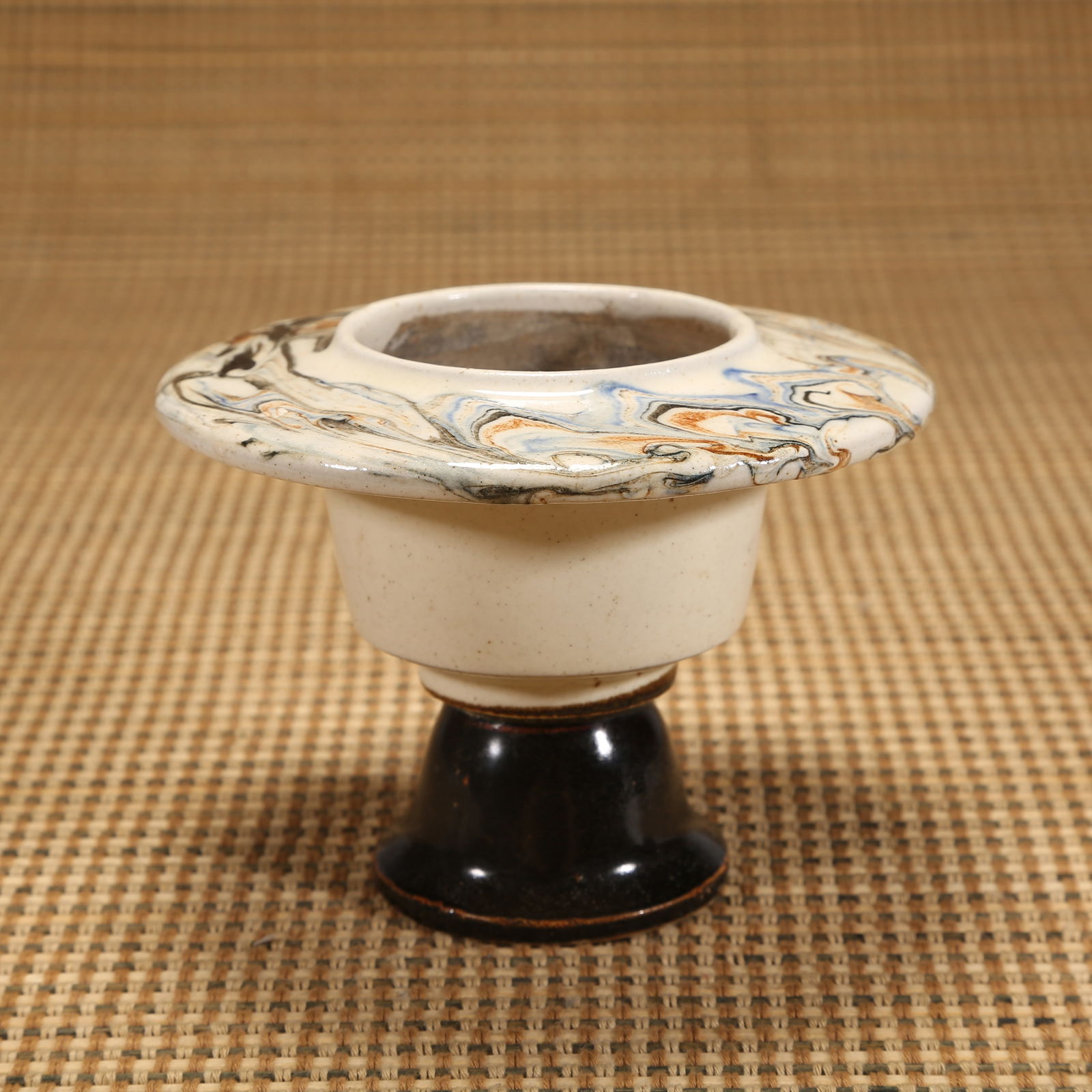 A TANG DYNASTY TWISTED-CLAY CUP (1 of 8)