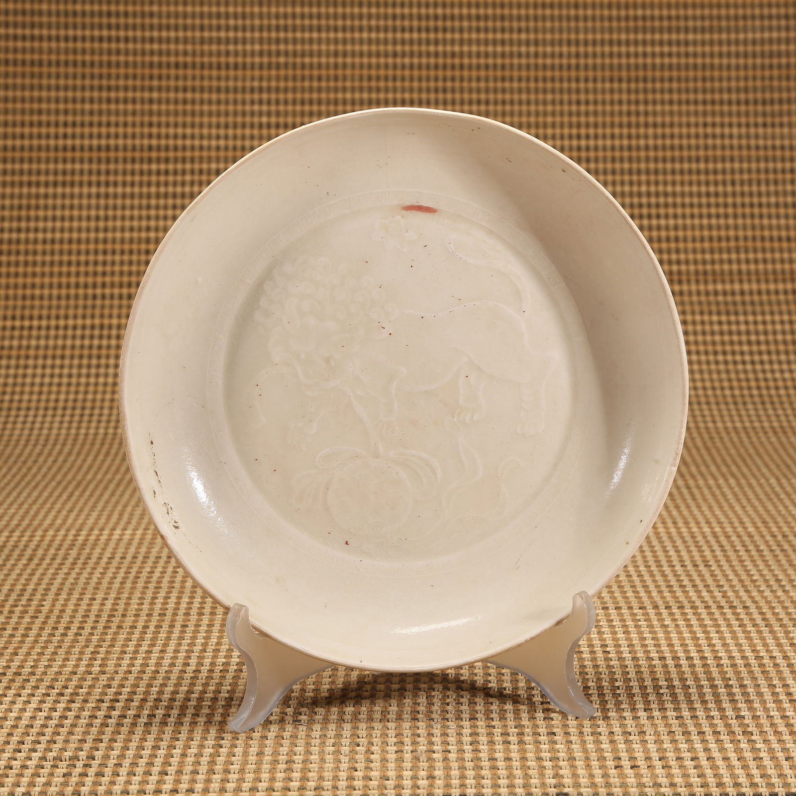 A SONG DYNASTY DING KILN LION PLAYING WITH EMBROIDERED BALL DISH (1 of 8)