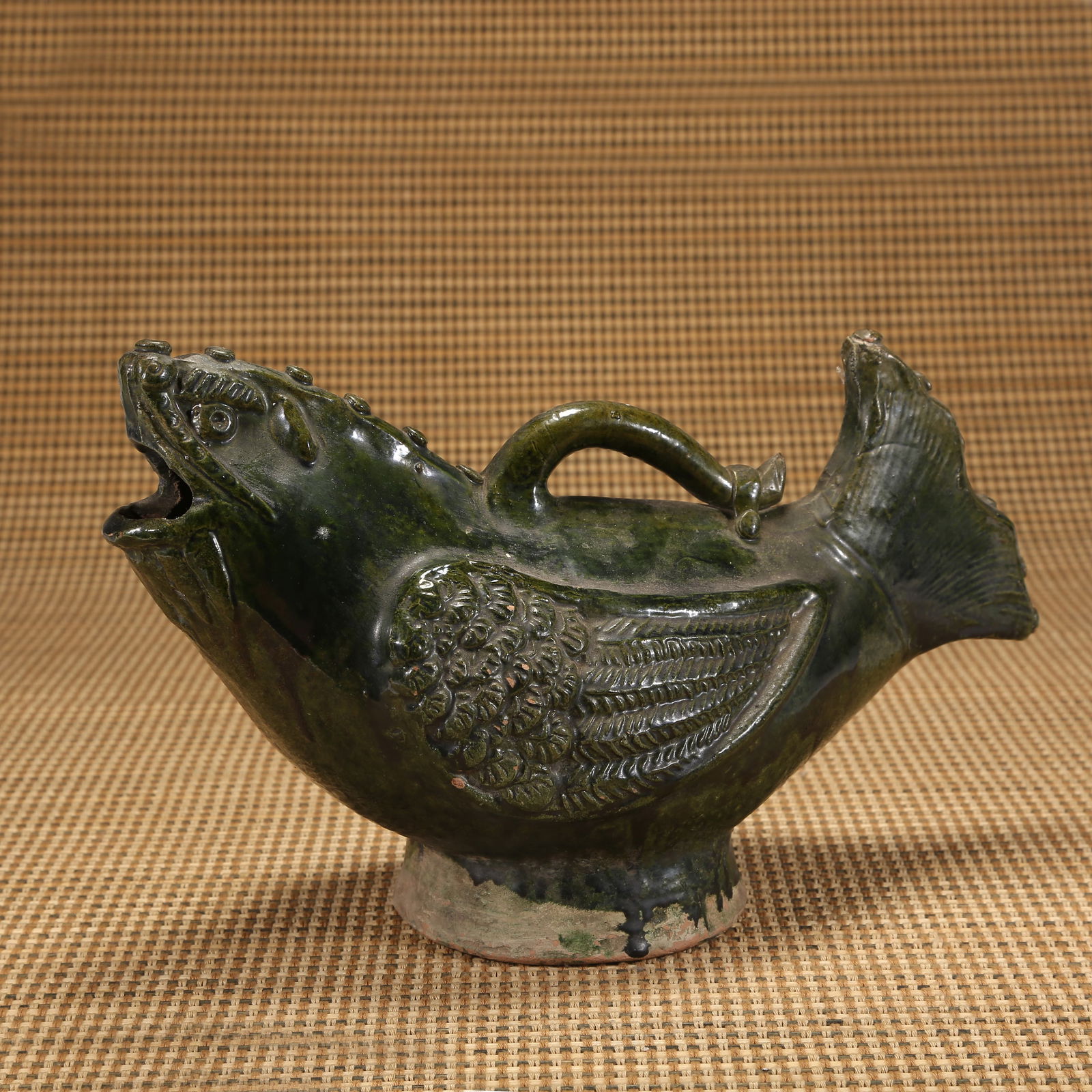 A TANG DYNASTY GREEN-GLAZED BELLOW-SHAPED EWER WITH TURTLE MOTIF (1 of 8)