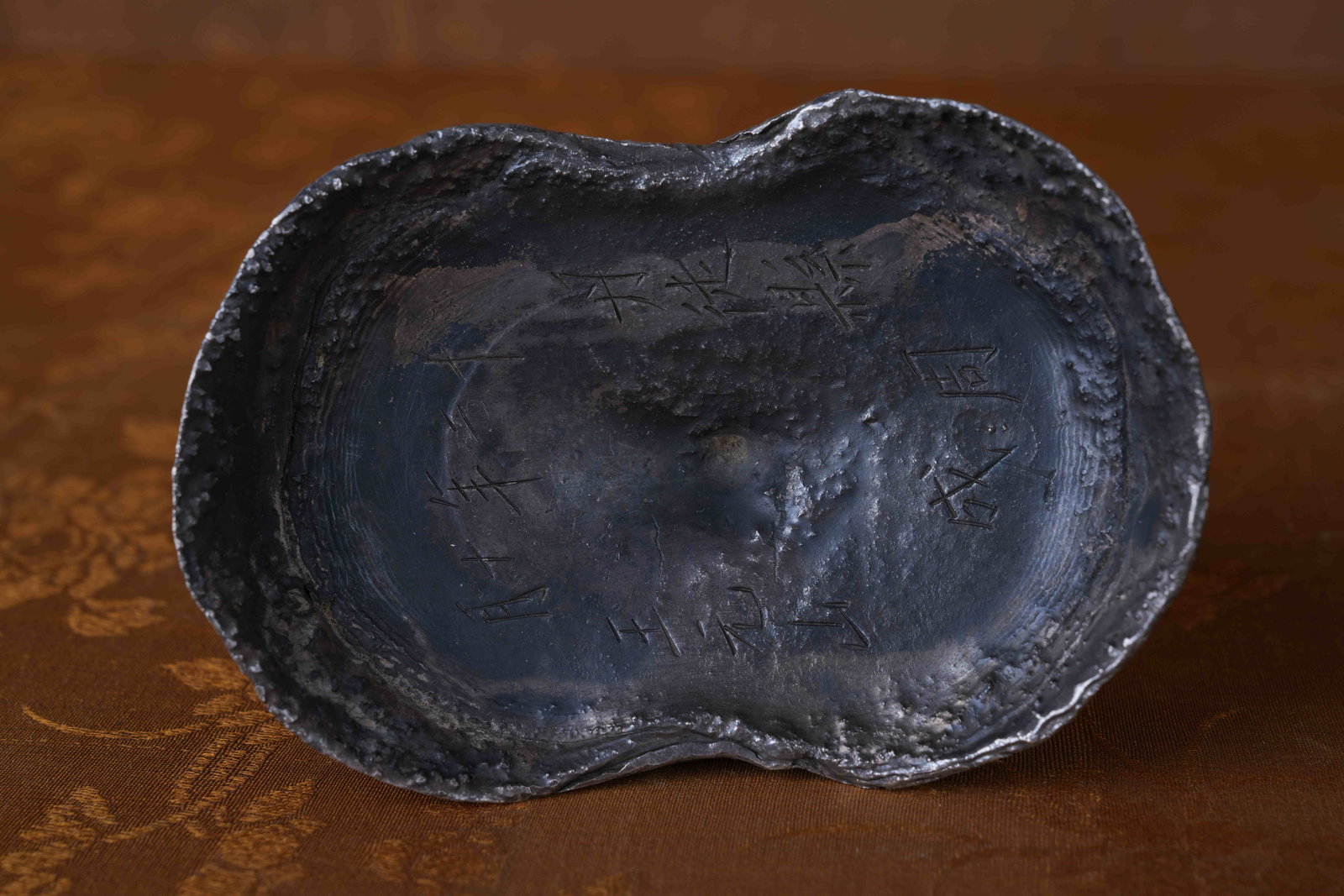 A SILVER INGOT (50 TAELS) (1 of 8)