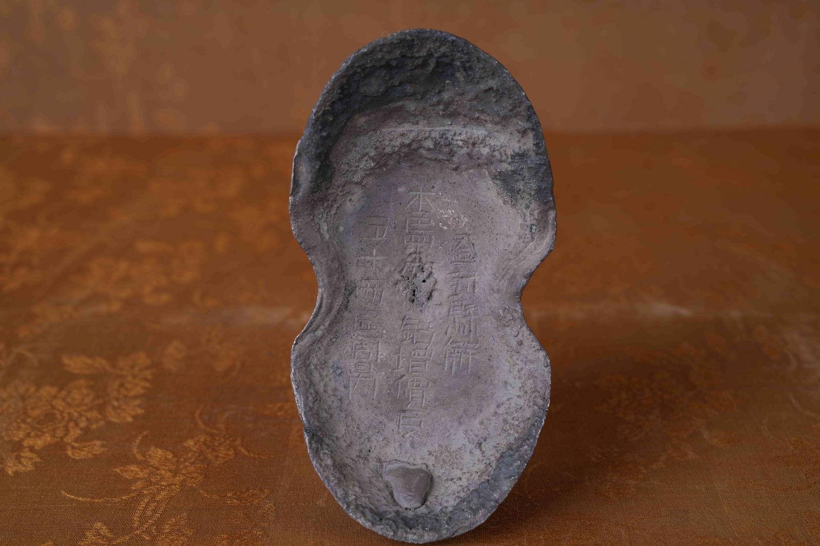 A SILVER INGOT (50 TAELS) (1 of 9)