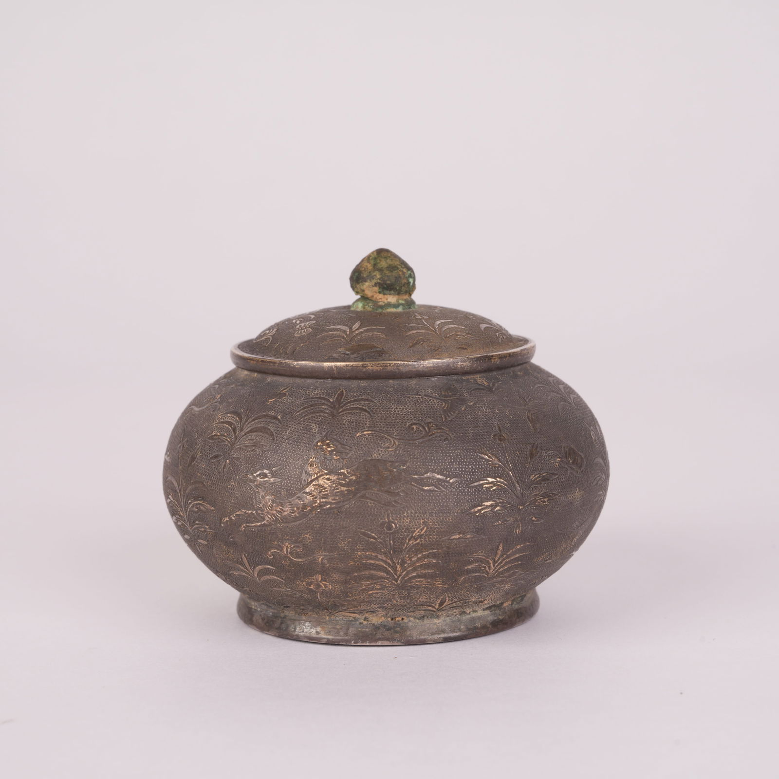 A SILVER COVERED JAR WITH FLORAL AND ANIMAL DESIGN, TANG DYNASTY: Silver Covered Jar with Floral and Animal Design, Tang Dynasty