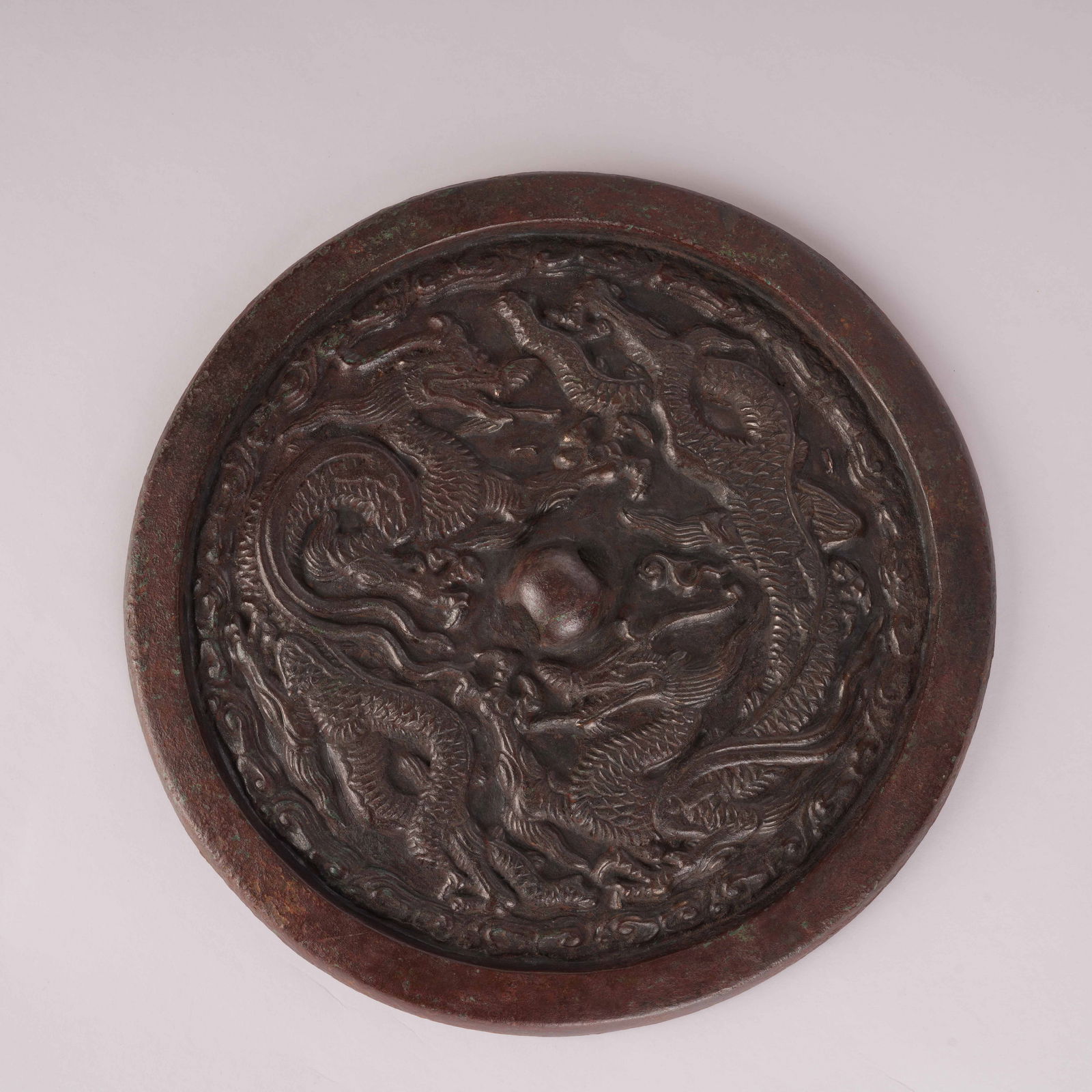 A BRONZE MIRROR WITH TWIN DRAGON DESIGN, JIN DYNASTY (1 of 9)