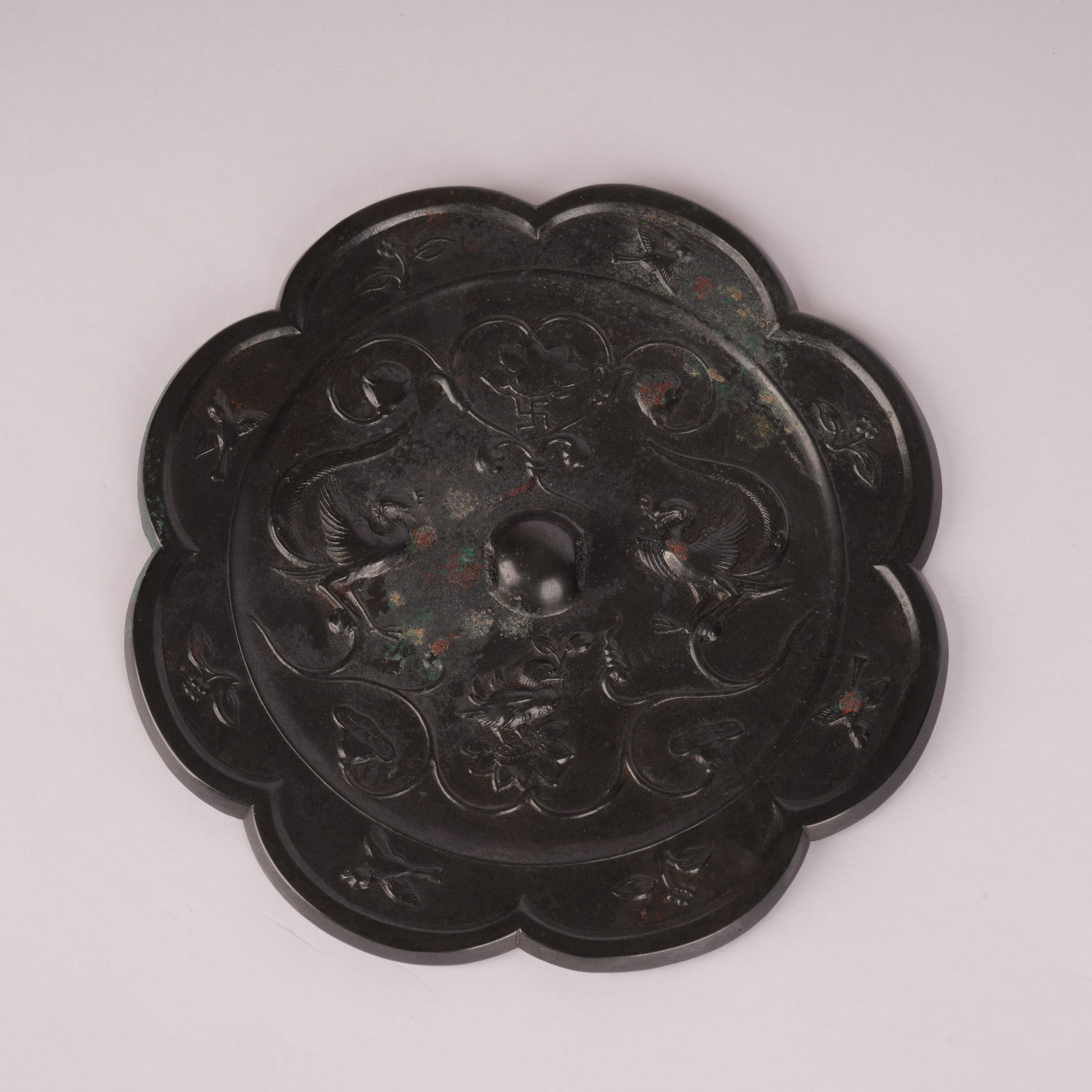 A BLACK-LACQUERED BRONZE MIRROR WITH TWIN PHOENIX DESIGN, TANG DYNASTY (1 of 8)