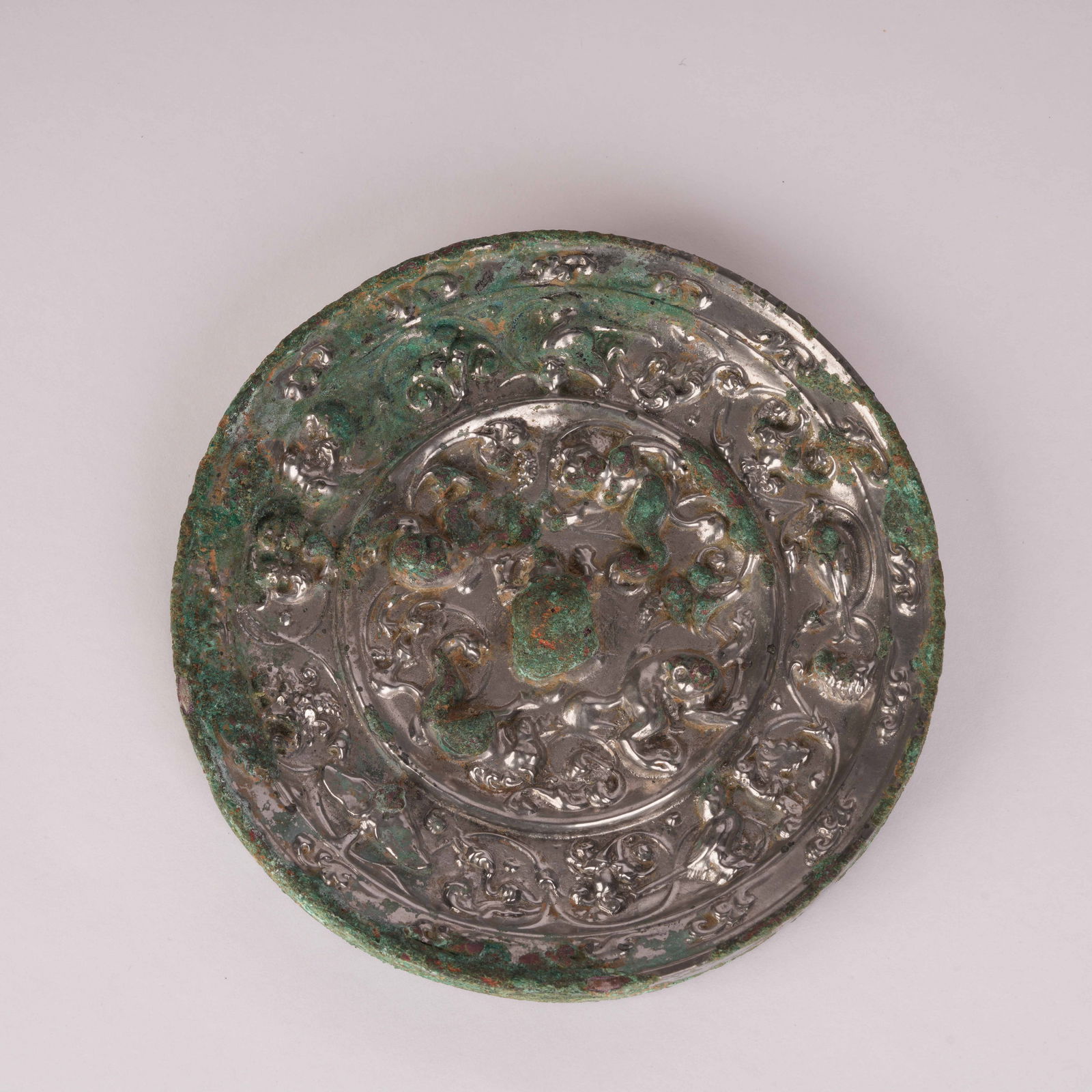 A GRAPEVINE AND SEA-BEAST BRONZE MIRROR, TANG DYNASTY (1 of 9)
