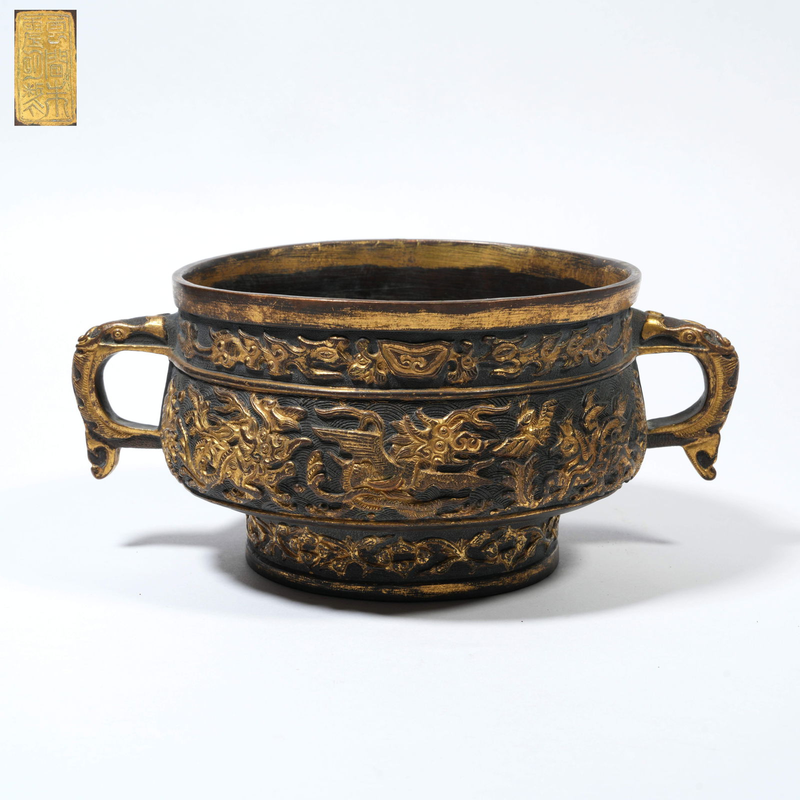 A BRONZE GUI-FORM CENSER WITH SEA-CREATURE MOTIFS, PARTIALLY GILT, MADE BY HU WENMING (1 of 10)