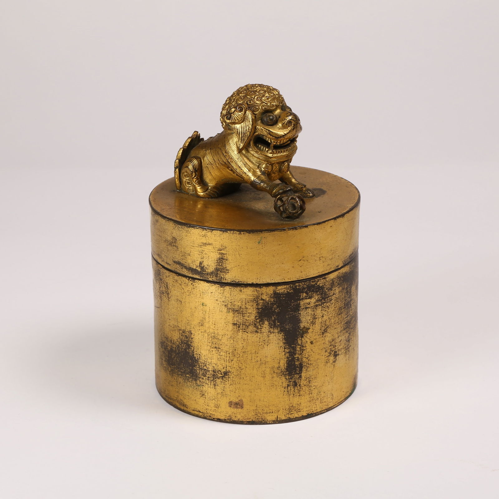 A GILT BRONZE COVERED JAR WITH LION FINIAL: Gilt Bronze Covered Jar with Lion Finial