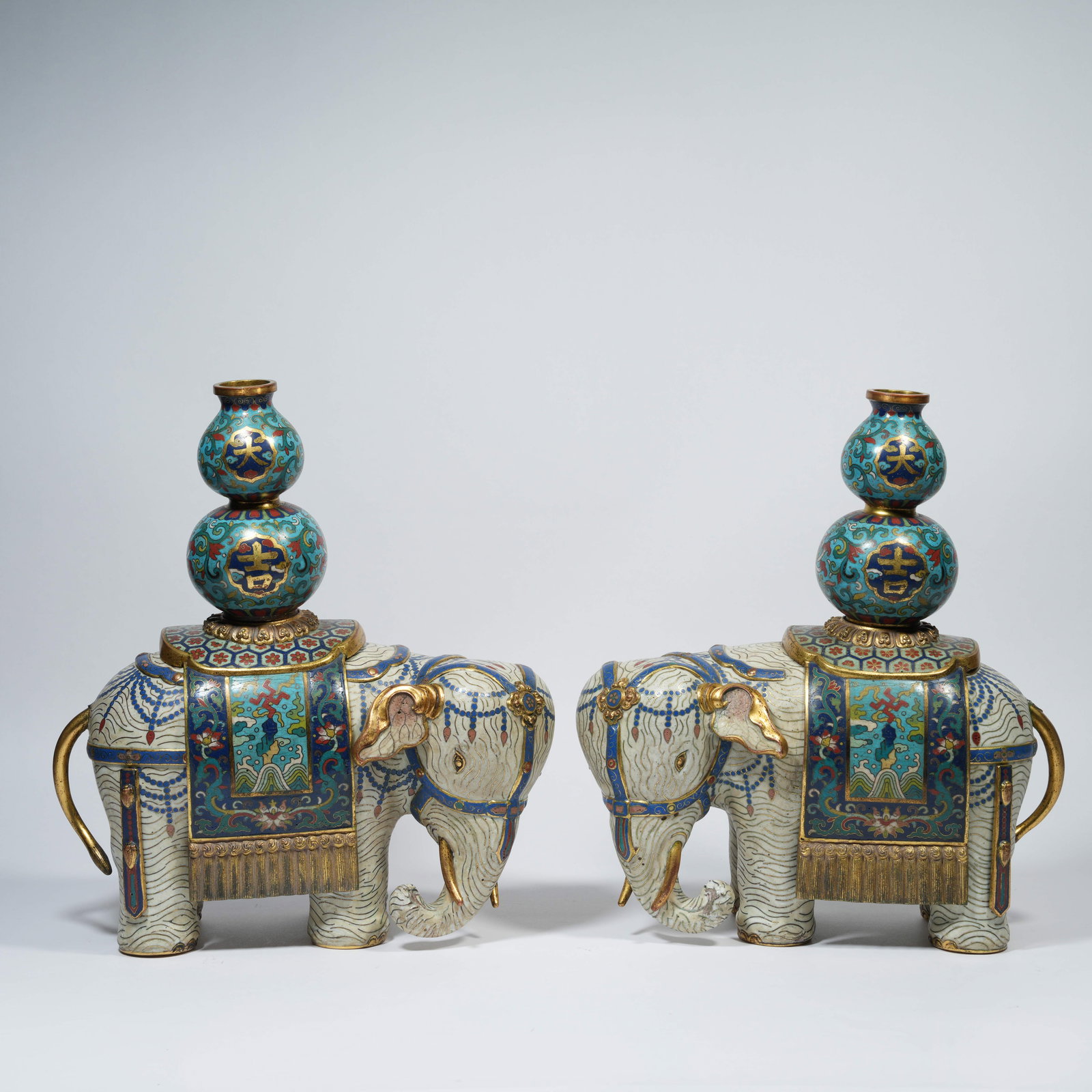 A CLOISONNÉ-ENAMEL "ELEPHANT BEARING PEACE" FORM INCENSE BURNERS ON BRONZE BODY (PAIR): Cloisonné-Enamel "Elephant Bearing Peace" Form Incense Burners on Bronze Body (Pair)