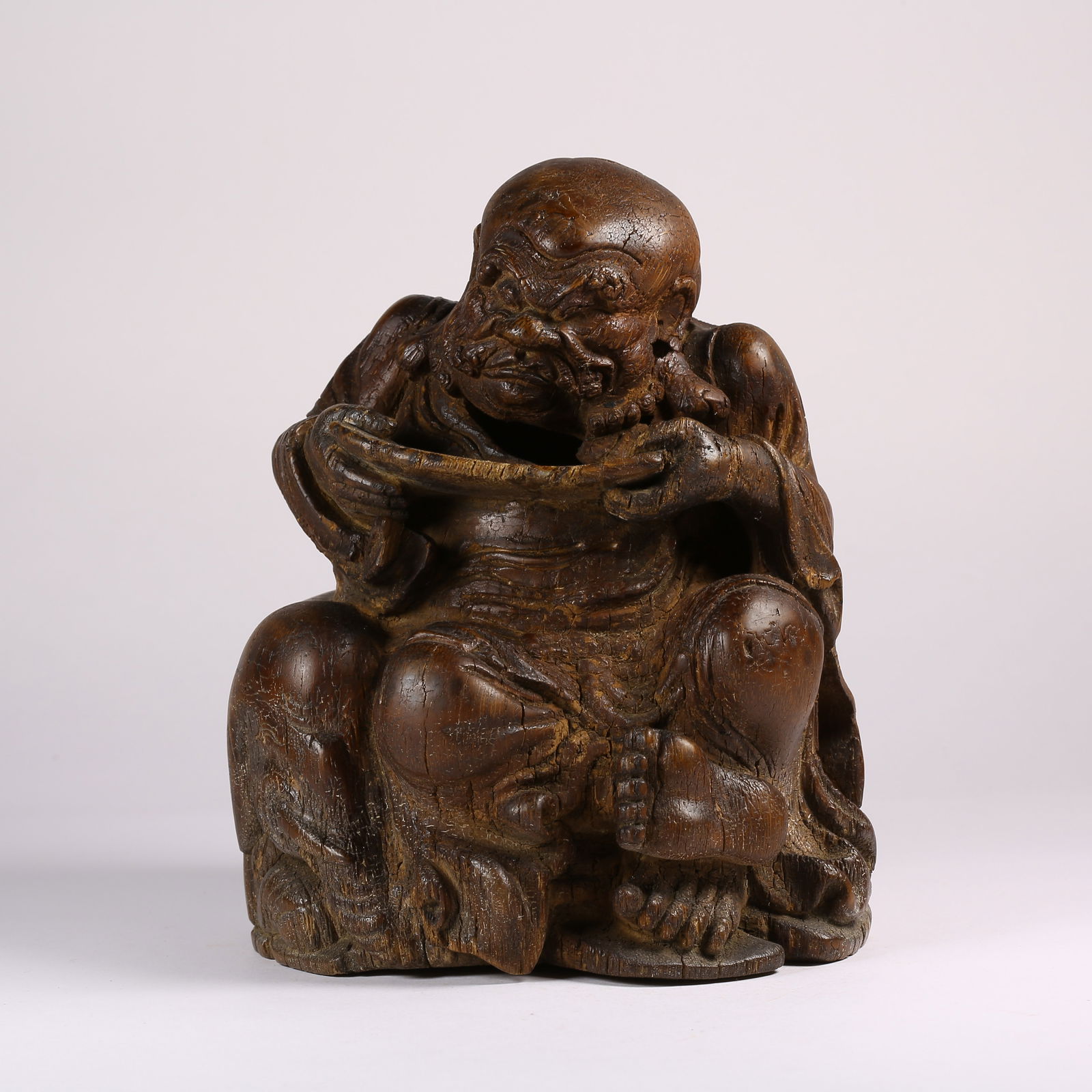 A BAMBOO ROOT CARVED ARHAT FIGURINE: Bamboo Root Carved Arhat Figurine