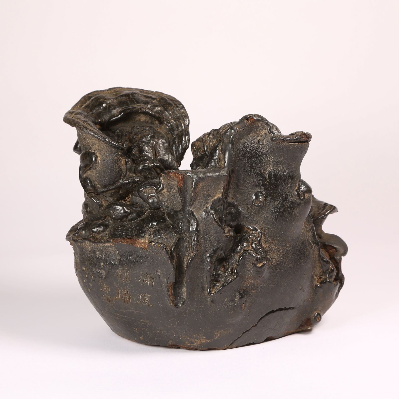 A LINGZHI-SHAPED "FULL COURTYARD OF BLESSINGS" SCHOLAR’S ROCK FIGURINE: Lingzhi-Shaped "Full Courtyard of Blessings" Scholar’s Rock Figurine